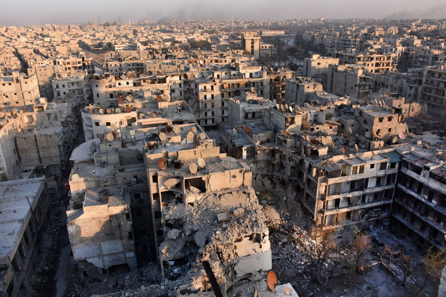 A general view of Aleppo taken from the top of a building in the city's Bustan al-Basha neighbourhood on November 28, 2016, during Syrian government forces assault to retake the entire northern city from rebel fighters.
In a major breakthrough in the push to retake the whole city, regime forces captured six rebel-held districts of eastern Aleppo over the weekend, including Masaken Hanano, the biggest of those in eastern Aleppo.  
 / AFP PHOTO / GEORGE OURFALIAN
