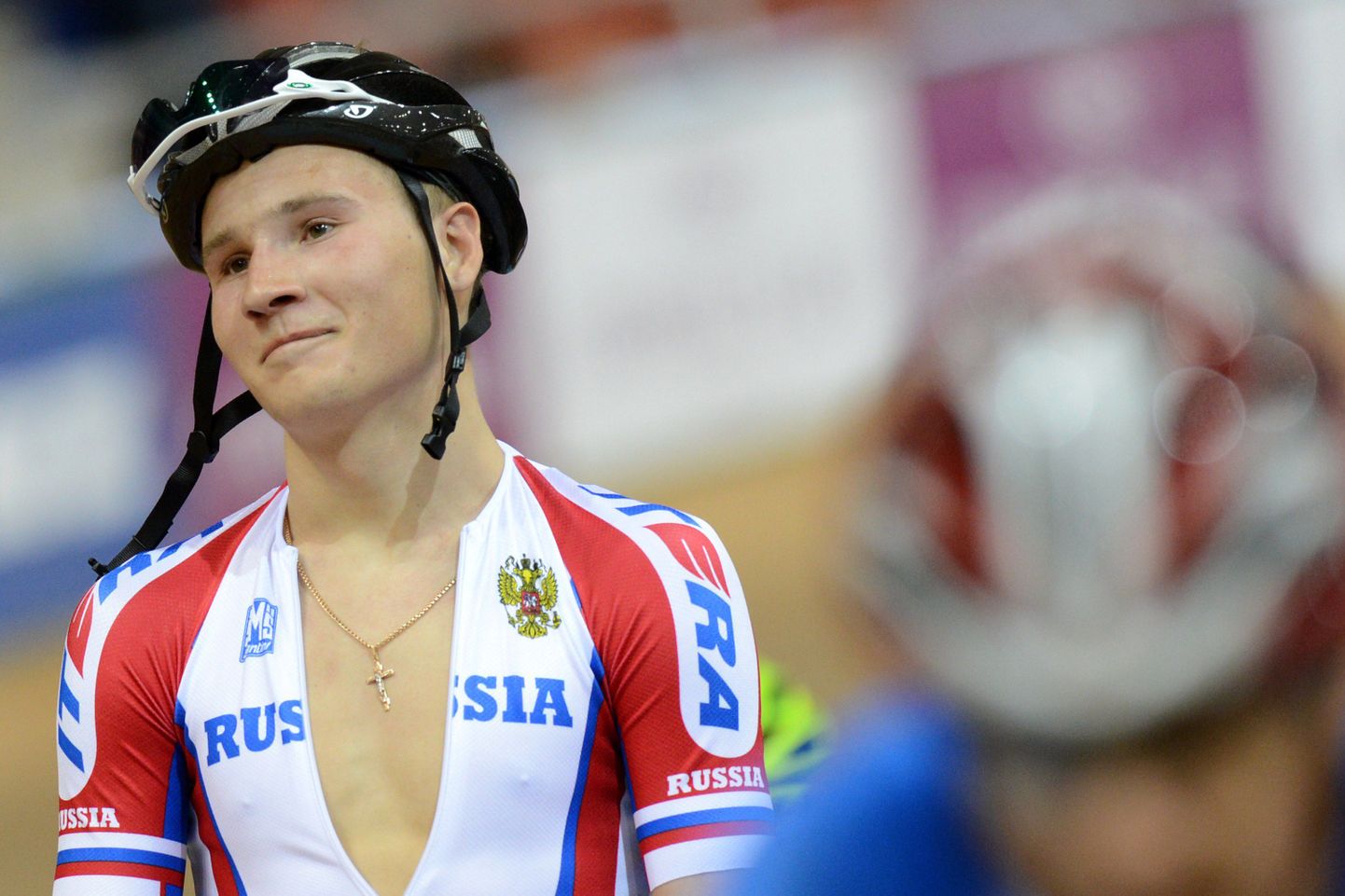 (FILES) This file picture dated on February 22, 2013 shows Russia's Kirill Sveshnikov, bronze, reacting after UCI Track Cycling World Championships Men's 40 km Point Race in Minsk. Medal-winning Russian track and road cyclist Kirill Sveshnikov has been suspended from competition and training after testing positive for a banned substance, the Russian anti-doping agency RUSADA said on March 5, 2014.AFP PHOTO/KIRILL KUDRYAVTSEV