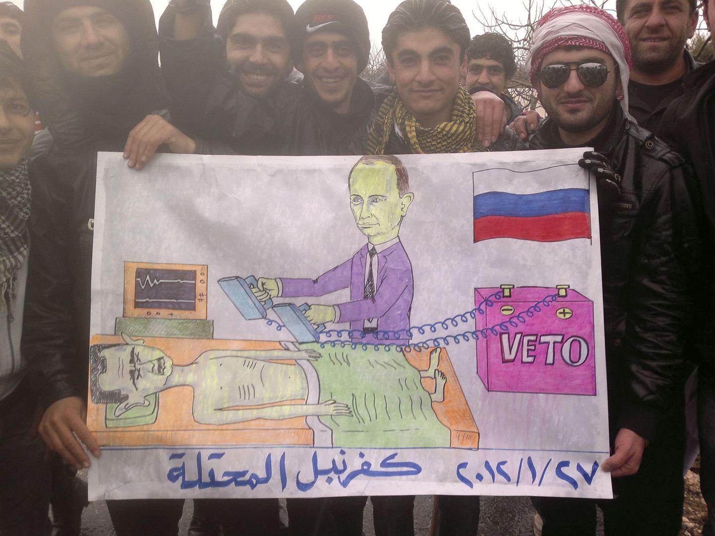 Протестующие против лидера Сирии Башара Асада нарисовали карикатуру на российского премьера Владимира Путина.