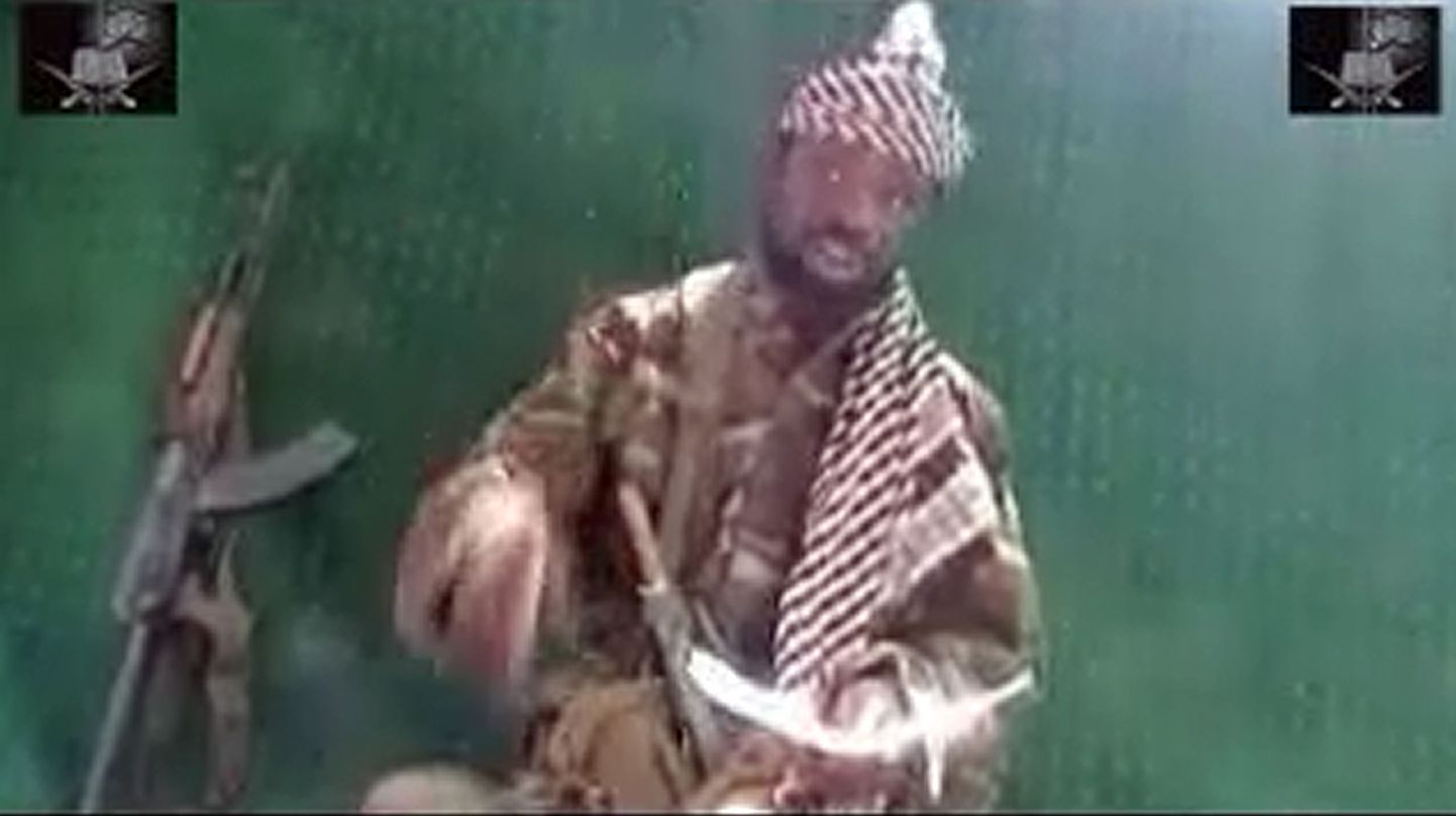 A grab made on May 29, 2013 from a video obtained by AFP shows the leader of the Islamist extremist group Boko Haram Abubakar Shekau, seated and dressed in camouflage with a turban, and an AK-47 at his side, claiming that Nigerian soldiers have retreated during an ongoing military offensive.  The leader of Islamist extremist group Boko Haram claims in a video obtained by AFP on Tuesday that Nigerian soldiers have retreated during an ongoing military offensive while insurgents have sustained little damage. The video marks the first public comments from Boko Haram leader Abubakar Shekau since the start of a sweeping offensive by the Nigerian army on May 15 and also includes a call for foreign Islamists to join the fight in Nigeria.
= RESTRICTED TO EDITORIAL USE - MANDATORY CREDIT "AFP PHOTO / BOKO HARAM" - NO MARKETING NO ADVERTISING CAMPAIGNS - DISTRIBUTED AS A SERVICE TO CLIENTS