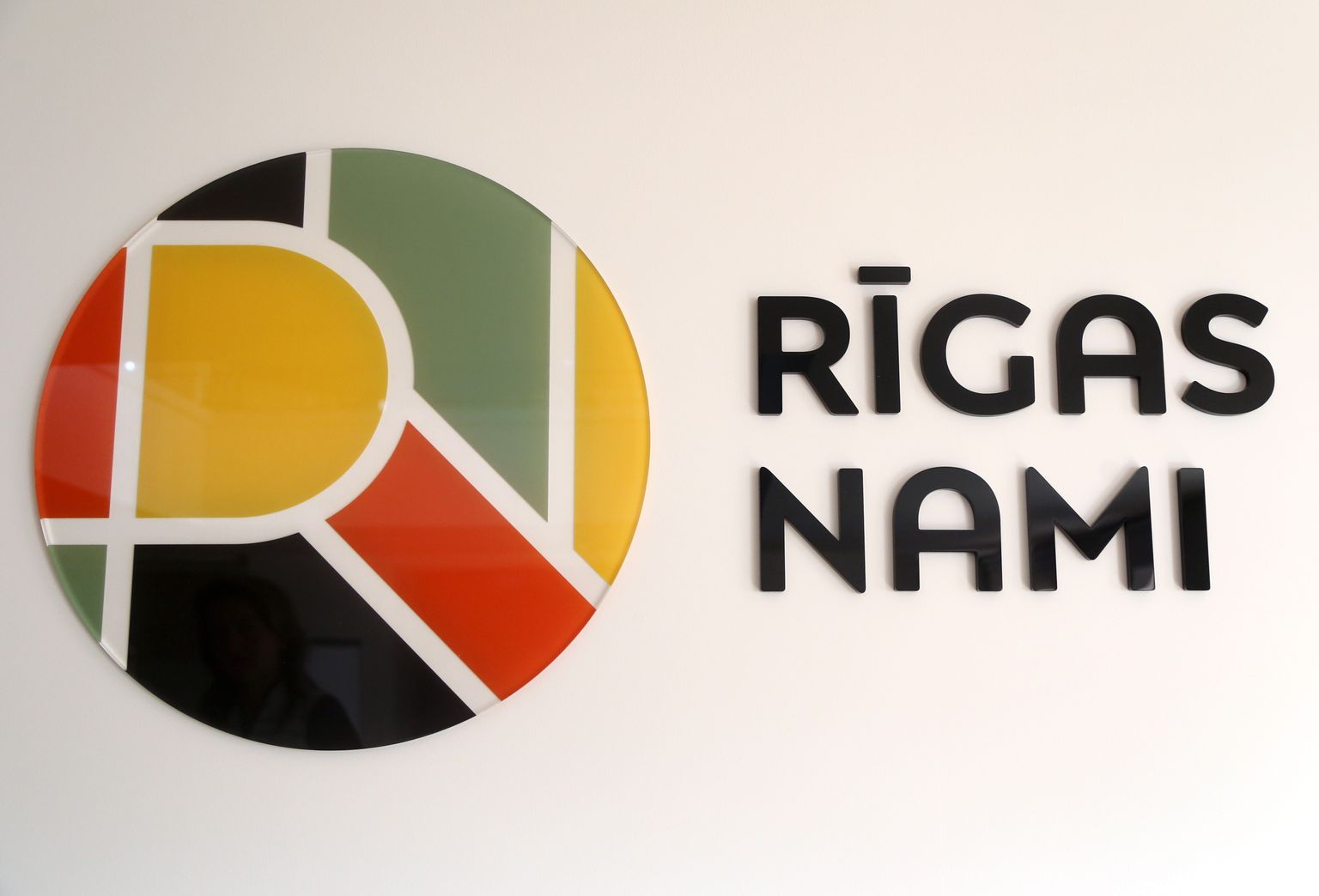 SIA "Rīgas nami" logo.