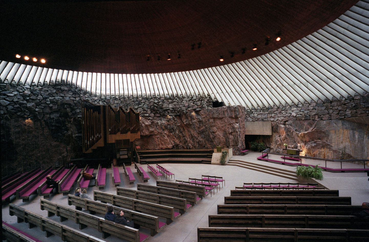 HELSINKI 20000201 
Interior of Temppeliaukio Church in Helsinki, Finland.  Designed by the architect brothers, Timo and Tuomo Suomalainen. The Church was built in 1968-1969. 
The church is built into solid rock, therefore, it is also known as the Church of the Rock. The acoustics are excellent and the church is often used for concerts.
Photo: Rolf Adlercreutz / SCANPIX  code 4349
