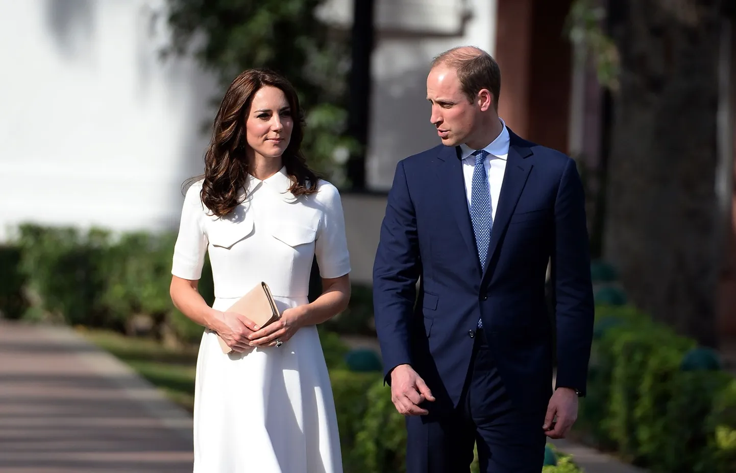 Britain's Prince William, along with his wife Kate, the Duchess of Cambridge walk as they pay tribute during a visit to Gandhi Smiriti, an Indian museum dedicated to Mahatma Gandhi in New Delhi, Monday, April 11, 2016. (Prakash Singh/Pool photo via AP)