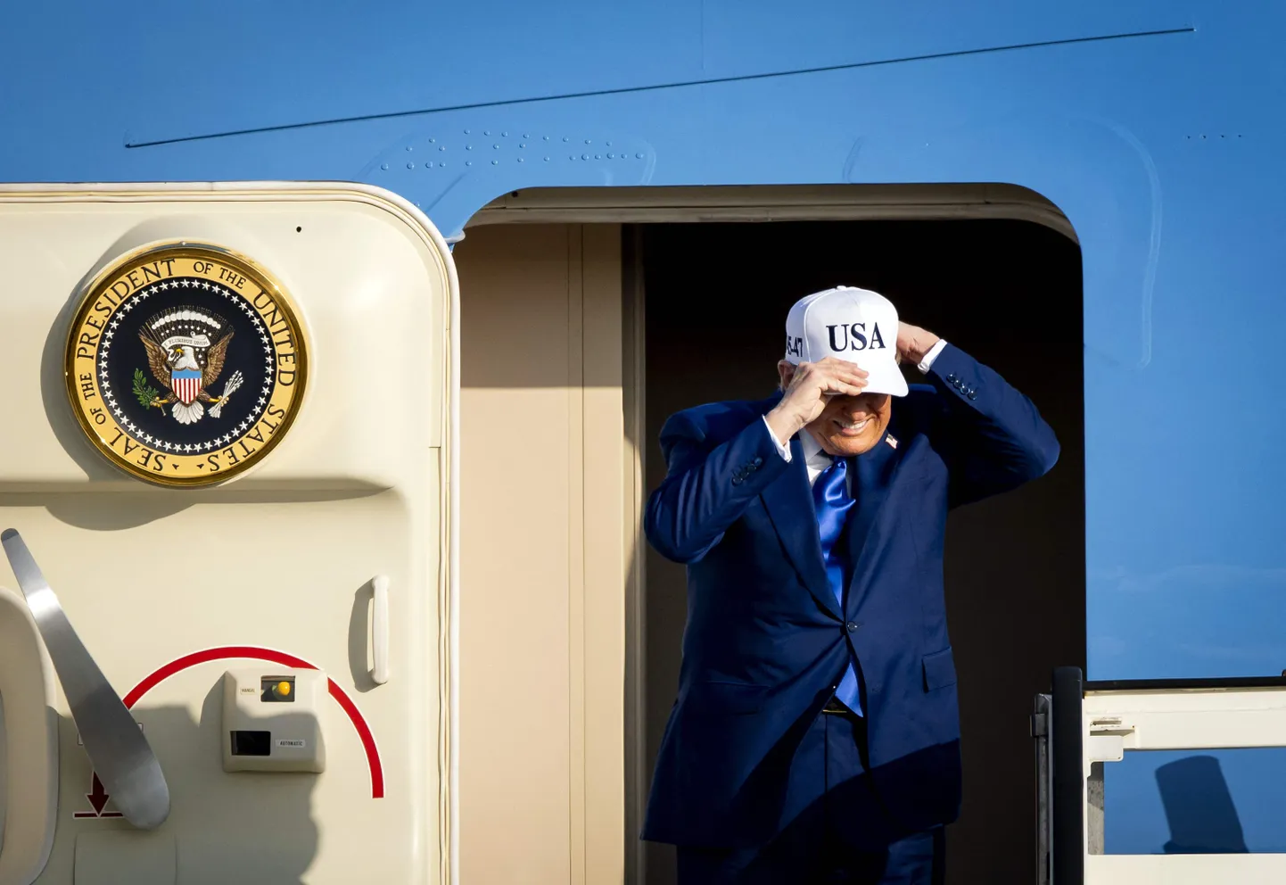 US President Donald Trump exits Air Force One after landing from Joint Base Andrews, Maryland, at Amsterdam's Schiphol aiport, to attend the NATO summit in The Hague, on June 24, 2025. NATO leaders hold a two-day summit on June 24 and 25 in The Hague. (Photo by Koen van Weel / ANP / AFP) / Netherlands OUT