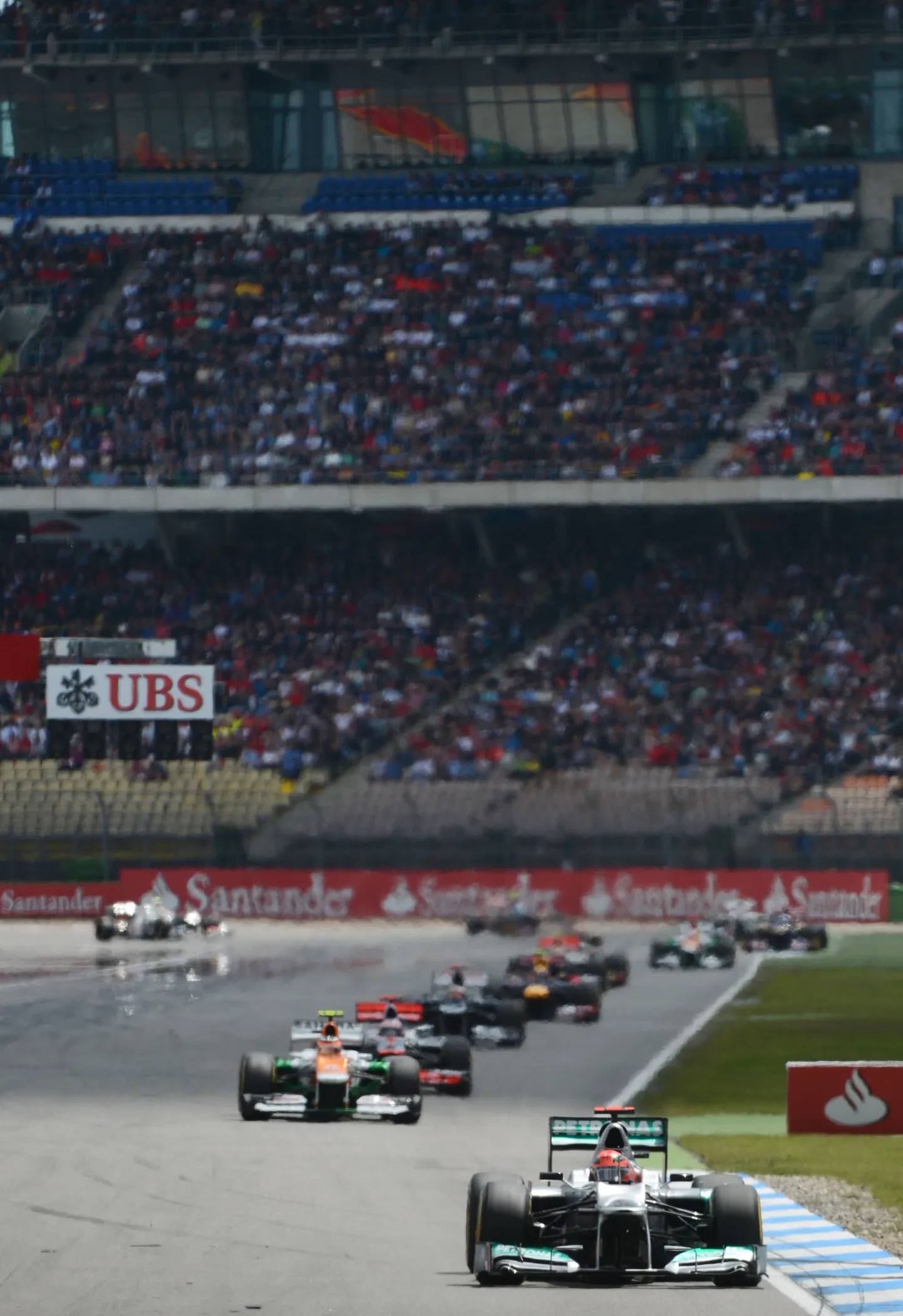 Mercedes'  German driver Michael Schumacher  drives at the Hockenheimring circuit on July 22, 2012 in Hockenheim during the German Formula OneGrand Prix.  AFP PHOTO / DIMITAR DILKOFF