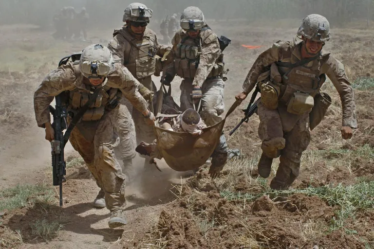 US Marines evacuating a soldier wounded in an improvised explosive device explosion in Helmand Province, Afghanistan.