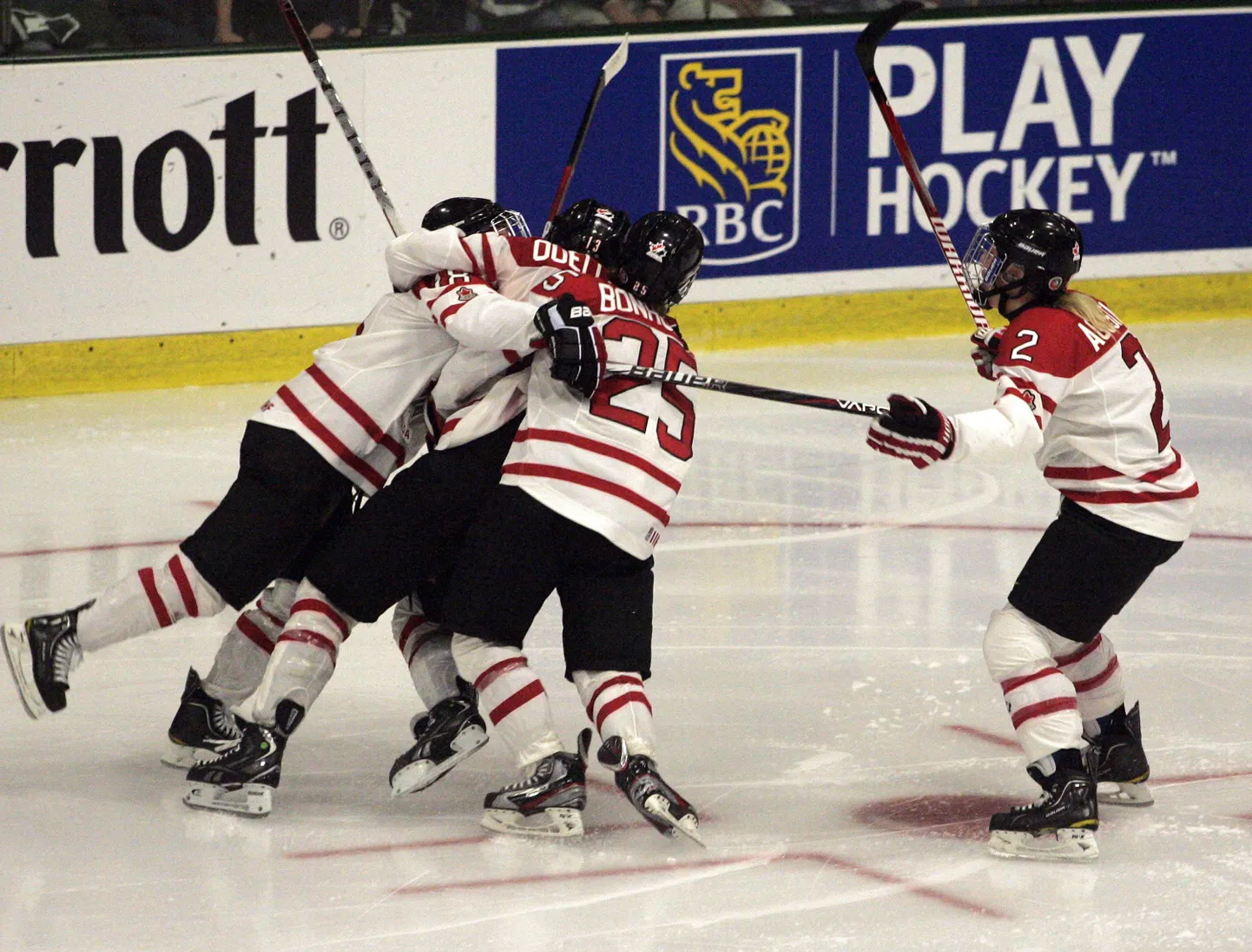 Canada's Caroline Ouellette celebrates her winning goal in sudden death overtime action to take the gold medal game between Canada and the USA at the IIHF Ice Hockey Women's World Championship in Burlington, Vermont April 14, 2012. REUTERS/Herb Swanson (UNITED STATES - Tags: SPORT ICE HOCKEY)