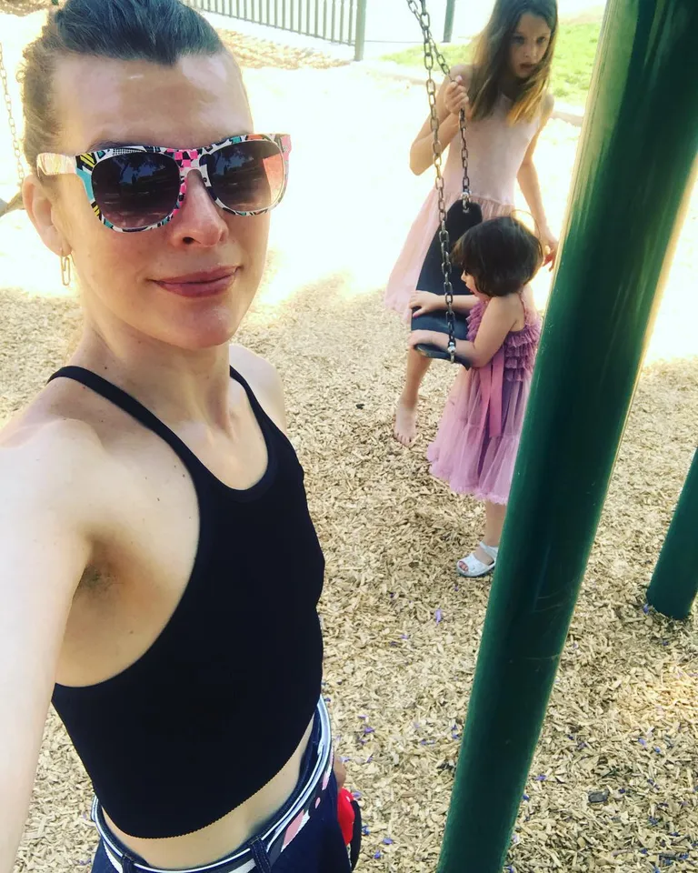 Milla Jovovich releases a photo on Instagram with the following caption: "A little bit of heaven. Going to the park with my kids is the most wonderful way to spend time together and see them play, watch the big one take care of the little one. I know some of you don\u2019t like it when i get political, so I\u2019ll apologize beforehand and feel free to stop reading. Saying that, of course I can\u2019t help but think of all the migrant families at our border right now who\u2019s reality is the polar opposite of mine. Though I don\u2019t condone people coming into the US illegally, I know that this country is a dream for most of the world. The promised land where we can make our dreams come true for our children. It\u2019s why my own family defected in the 80\u2019s. To make a better life for me. Their child. I do understand why people would risk everything to come here. It must be so awful where they came from if they would risk so much to get here. If anyone looking at this has the desire and funds to help families at the border, ive posted the organizations I\u2019ve contributed to in my bio. If you don\u2019t have the funds i totally get it and no need to even mention it in your comments. If you don\u2019t agree or believe in this cause I totally get that too, all I ask is please be respectful leaving comments on my page. I would really appreciate it. Best, m\u2764\ufe0f\u2764\ufe0f\u2764\ufe0f p.s. and yes, I\u2019m flat and i didn\u2019t shave my pits.\ud83d\ude2c#ladiary". Photo Credit: Instagram *** No USA Distribution *** For Editorial Use Only *** Not to be Published in Books or Photo Books *** Please note: Fees charged by the agency are for the agency’s services only, and do not, nor are they intended to, convey to the user any ownership of Copyright or License in the material. The agency does not claim any ownership including but not limited to Copyright or License in the attached material. By publishing this material you expressly agree to indemnify and to hold the agency and its directors, shareholders and employees harmless from any loss, claims, damages, demands, expenses (including legal fees), or any causes of action or allegation against the agency arising out of or connected in any way with publication of the material.