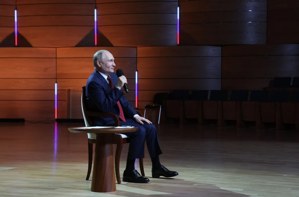 Russian President Vladimir Putin talks with students at the Sirius Educational Center in Sochi on May 19, 2025, after a telephone conversation with US President Donald Trump.