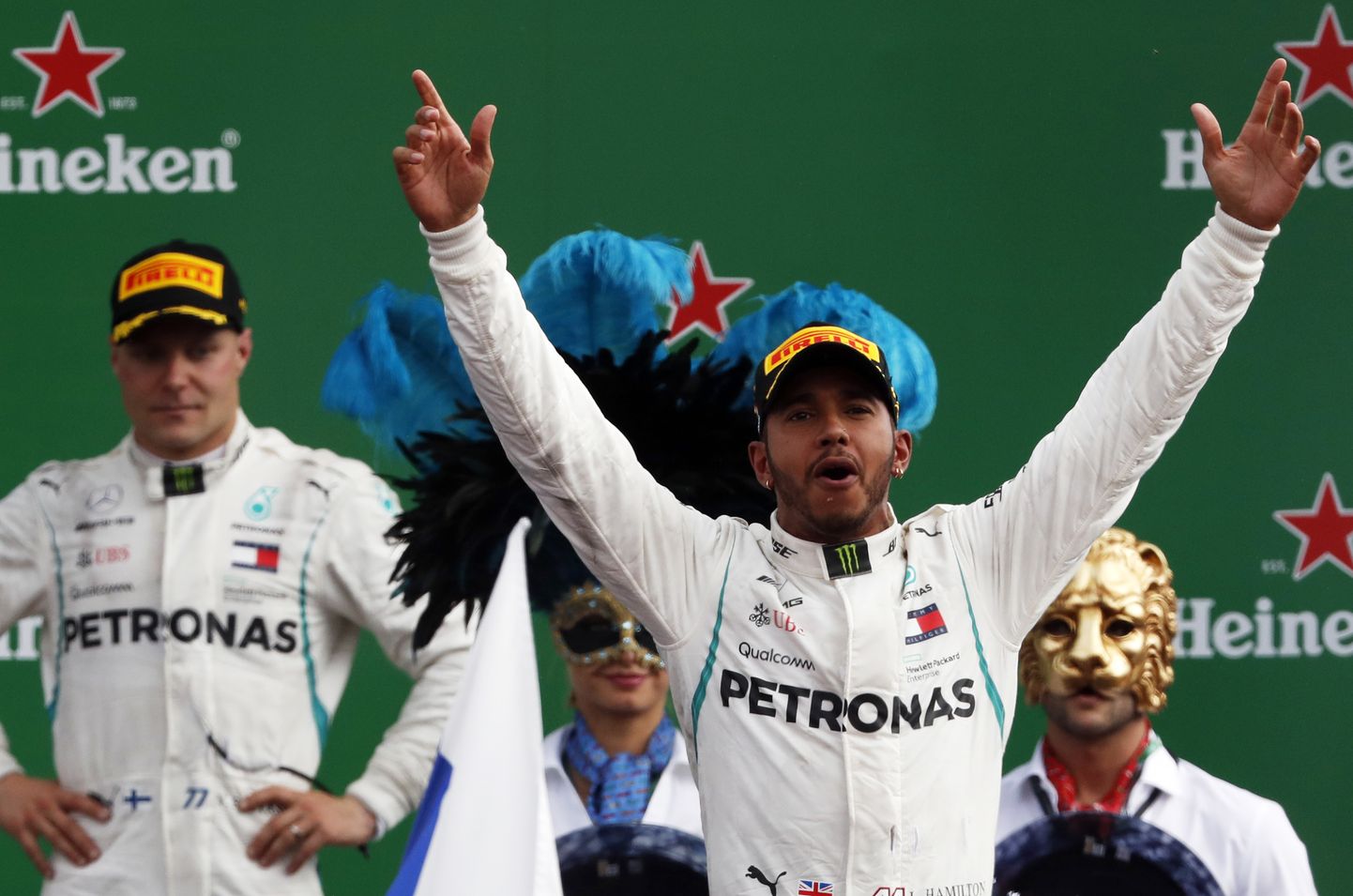 Mercedes driver Lewis Hamilton of Britain celebrates on the podium after winning the Formula One Italy Grand Prix at the Monza racetrack, in Monza, Italy, Sunday, Sept. 2, 2018. (AP Photo/Antonio Calanni)