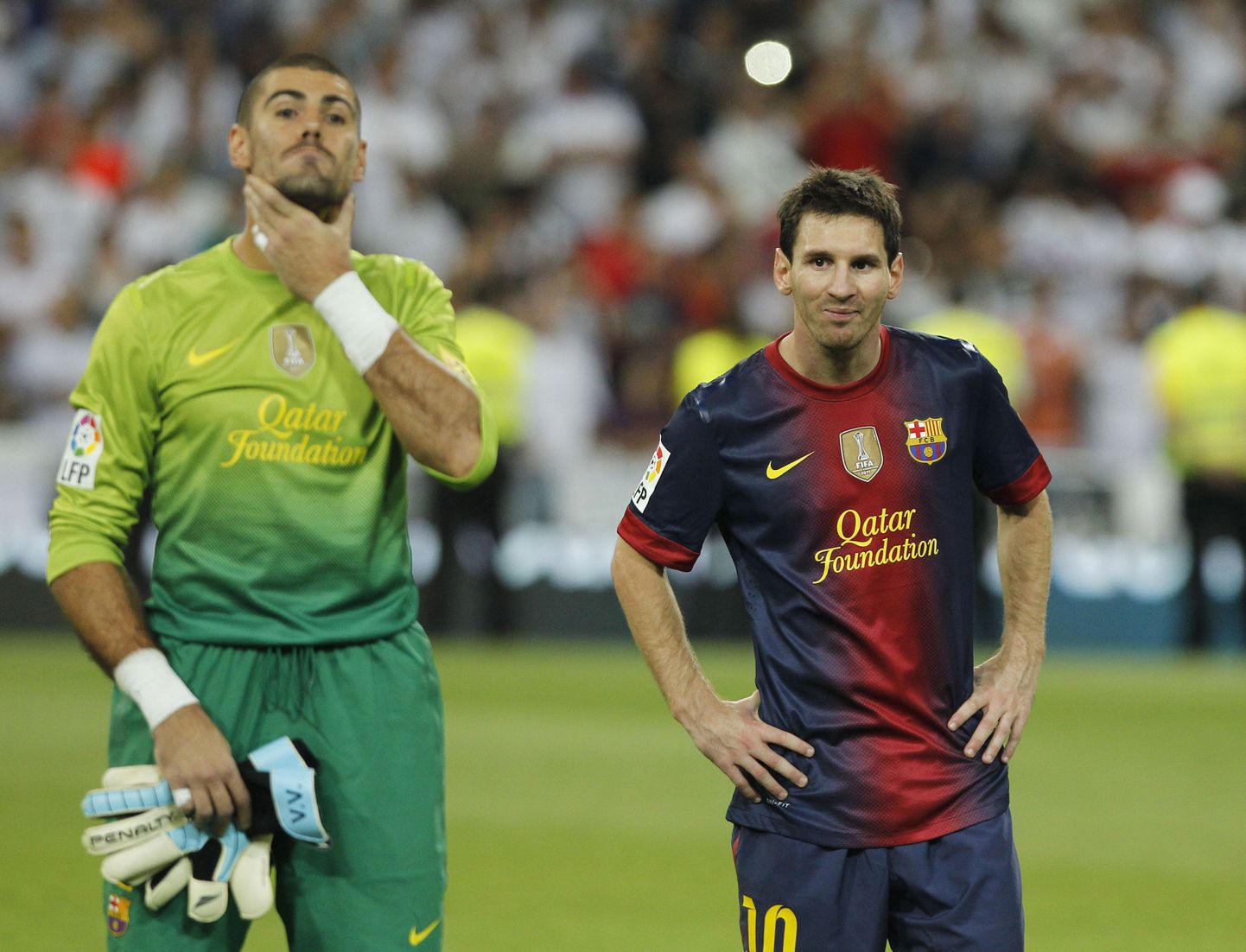 Victor Valdes (vasakul) ja Lionel Messi.