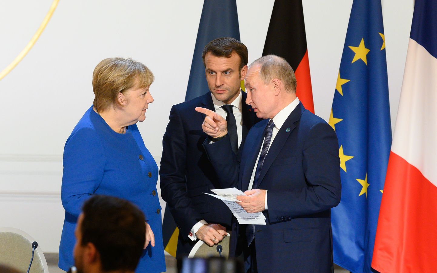 Vācijas kanclere Angela Merkele, Francijas prezidents Emanuels Makrons, Krievijas prezidents Vladimirs Putins.