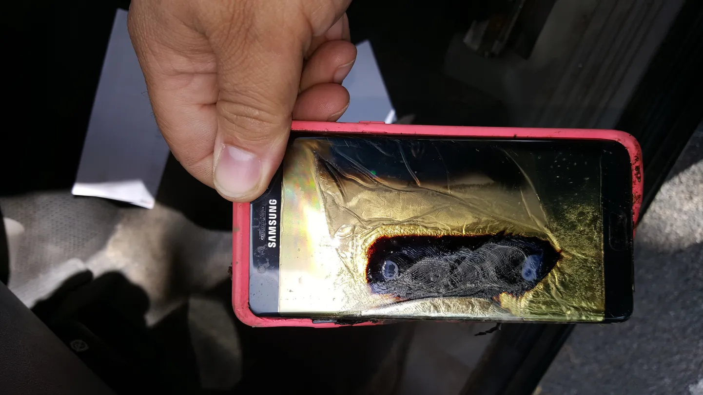 This Friday, Oct. 7, 2016, photo provided by Andrew Zuis, of Farmington, Minn., shows the replacement Samsung Galaxy Note 7 phone belonging to his 13-year-old daughter Abby, that melted in her hand earlier in the day. "She's done with Note 7s right now," Zuis said of his daughter. Reports of more replacement phones catching fire are trickling in, and the South Korean tech giant faces more scrutiny after earlier criticism for being slow to react and sending confusing signals in the first days of the recall. (Andrew Zuis via AP)