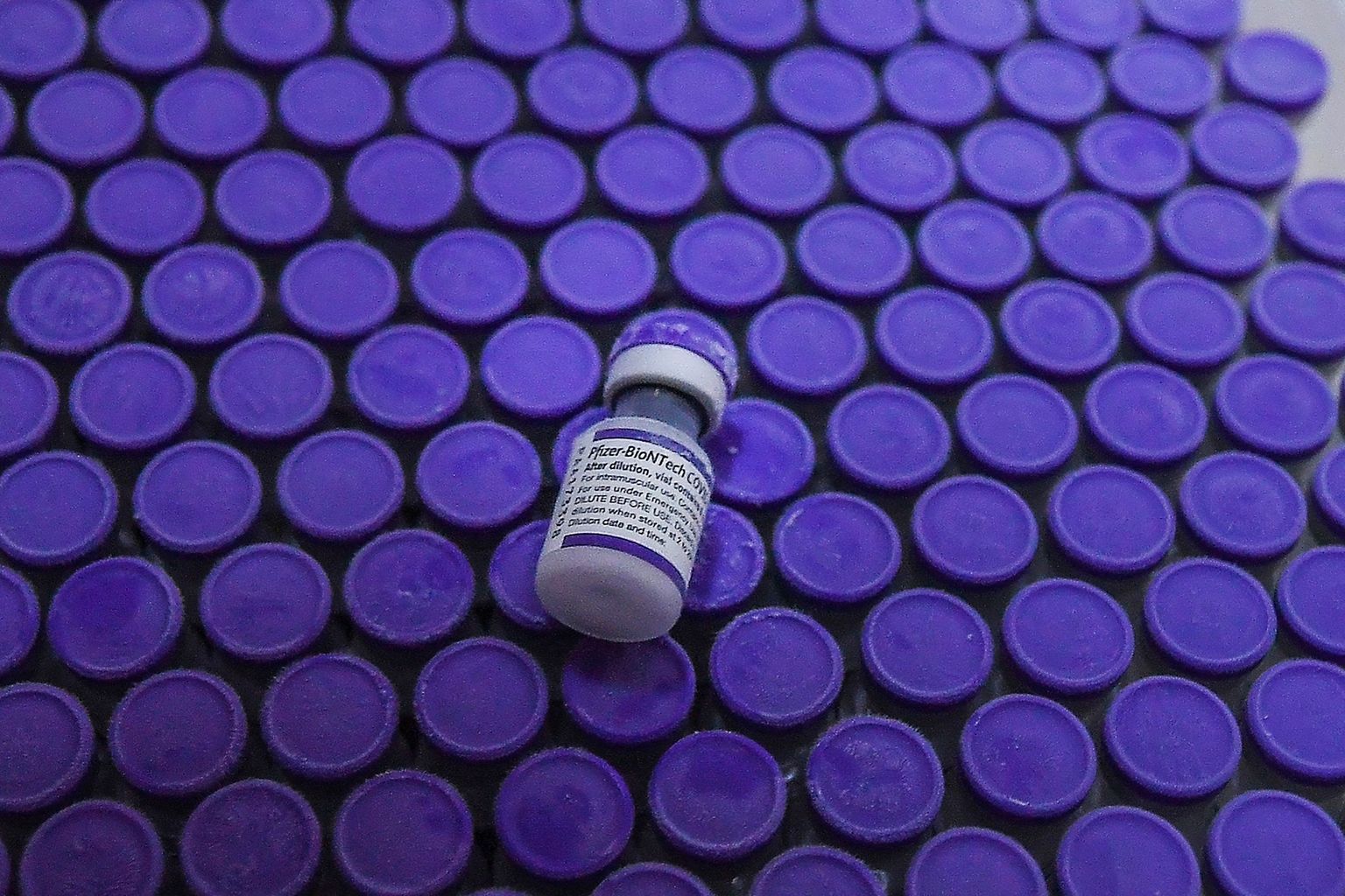 Vials of the Pfizer/BioNTech Covid-19 coronavirus vaccine are seen before being taken to a cold-storage freezer at the National Institute Of Hygiene And Epidemiology in Hanoi on October 12, 2021. (Photo by Nhac NGUYEN / AFP)