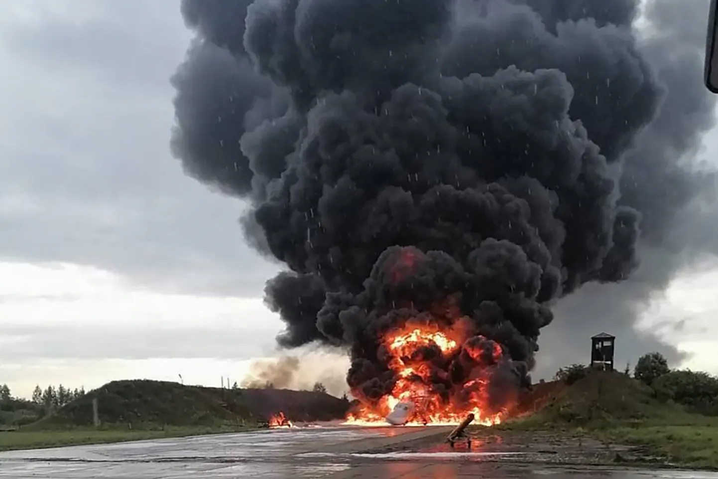 Russian warplane is burning on the Soltsy air base in the Novgorod region in northwestern Russia on Sunday, Aug. 20, 2023.