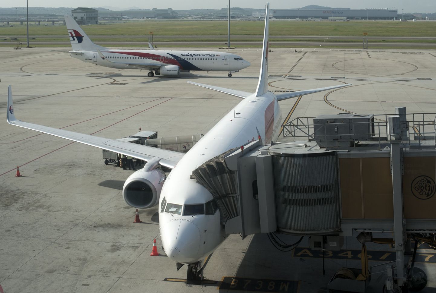 Malaysia airlines planes are seen on the tarmac at the Kuala Lumpur International Airport in Sepang on July 18, 2014. A Malaysian airliner carrying 298 people from Amsterdam to Kuala Lumpur crashed on July 17 in rebel-held east Ukraine, as Kiev said the jet was shot down in a "terrorist" attack. Ukraine's government and pro-Russian insurgents traded blame for the disaster, with comments attributed to a rebel commander suggesting his men may have downed Malaysia Airlines flight MH17 by mistake, believing it was a Ukrainian army transport plane. AFP PHOTO/ Nicolas ASFOURI