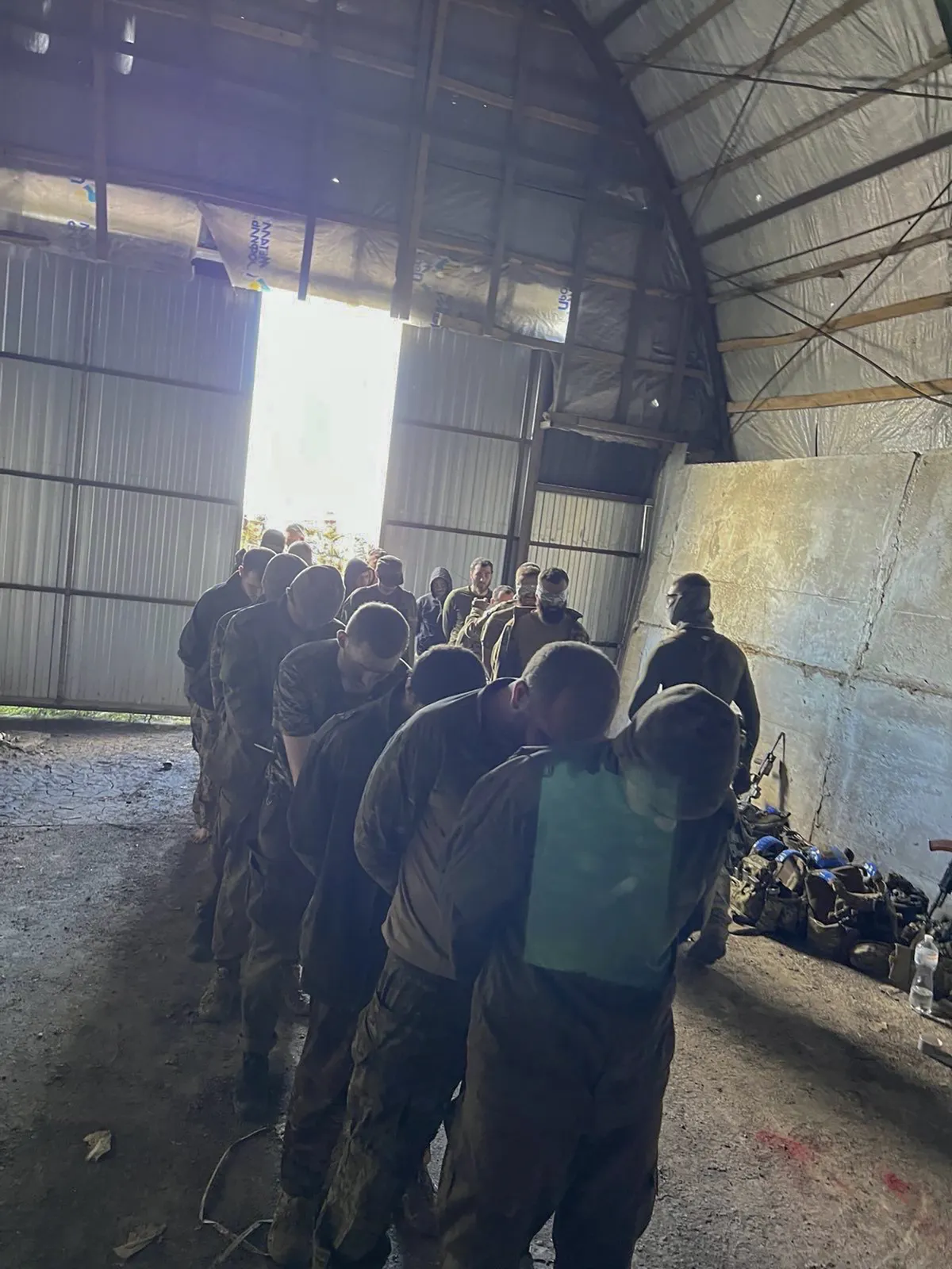 Over 100 Russian prisoners of war captured by Ukrainian Security Service special unit during one military action are seen in a shelter in Kursk region, Russia, Aug. 14, 2024.