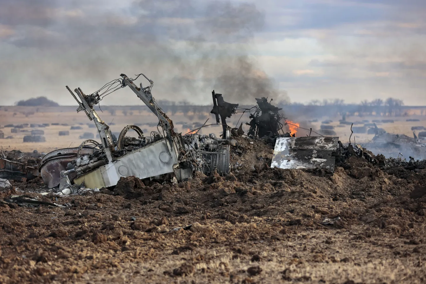 The wreckage of a warplane burns after it crashed near Yenakijeve, Russian-controlled Donetsk region, eastern Ukraine.