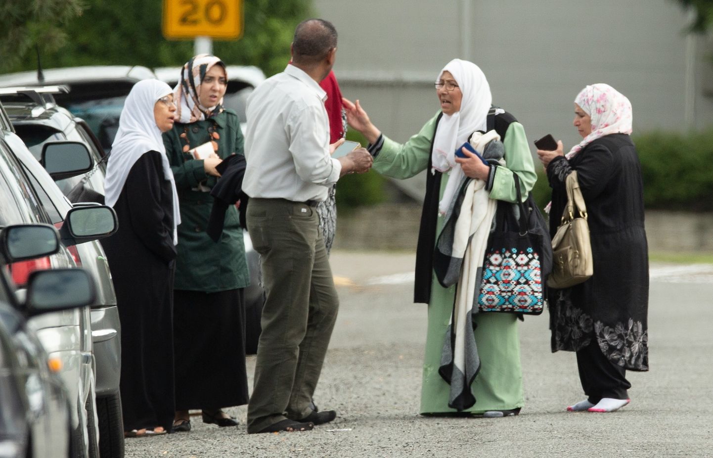 epa07438399 Shocked family members stand outside the mosque following a shooting resulting in multiple fatalies and injuries at the Masjid Al Noor on Deans Avenue in Christchurch, New Zealand, 15 March 2019. According to media reports on 15 March 2019, at least one gunman opened fire at around 1:40 pm local time after walking into the Masjid Al Noor Mosque, killing and wounding several of people. Armed police officers were deployed to the scene, along with emergency service personnel. There are also confirmed reports of a shooting at a second mosque in Christchurch, and both incidents have left at least 40 people dead and more than 20 people seriously wounded. Four people are in custody in connection with the shootings.  EPA/Martin Hunter NEW ZEALAND OUT