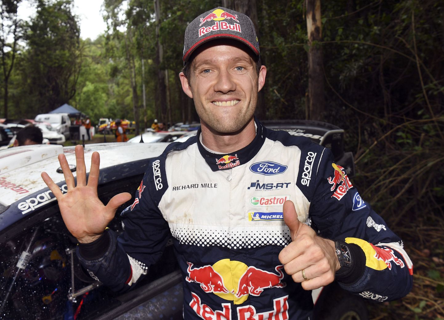 Ford driver Sebastien Ogier of France celebrates winning his sixth world rally title after finishing fifth on the final day of the World Rally Championship (WRC) Rally Australia near Coffs Harbour on November 18, 2018. (Photo by WILLIAM WEST / AFP) / -- IMAGE RESTRICTED TO EDITORIAL USE - STRICTLY NO COMMERCIAL USE --