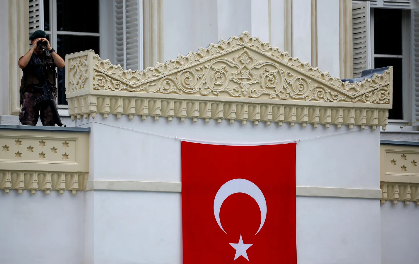 FILE PHOTO: A member of police special forces stands guard as Turkish President Tayyip Erdogan attends the re-opening of the Ottoman-era Yildiz Hamidiye mosque in Istanbul, Turkey, August 4, 2017. REUTERS/Murad Sezer/File Photo