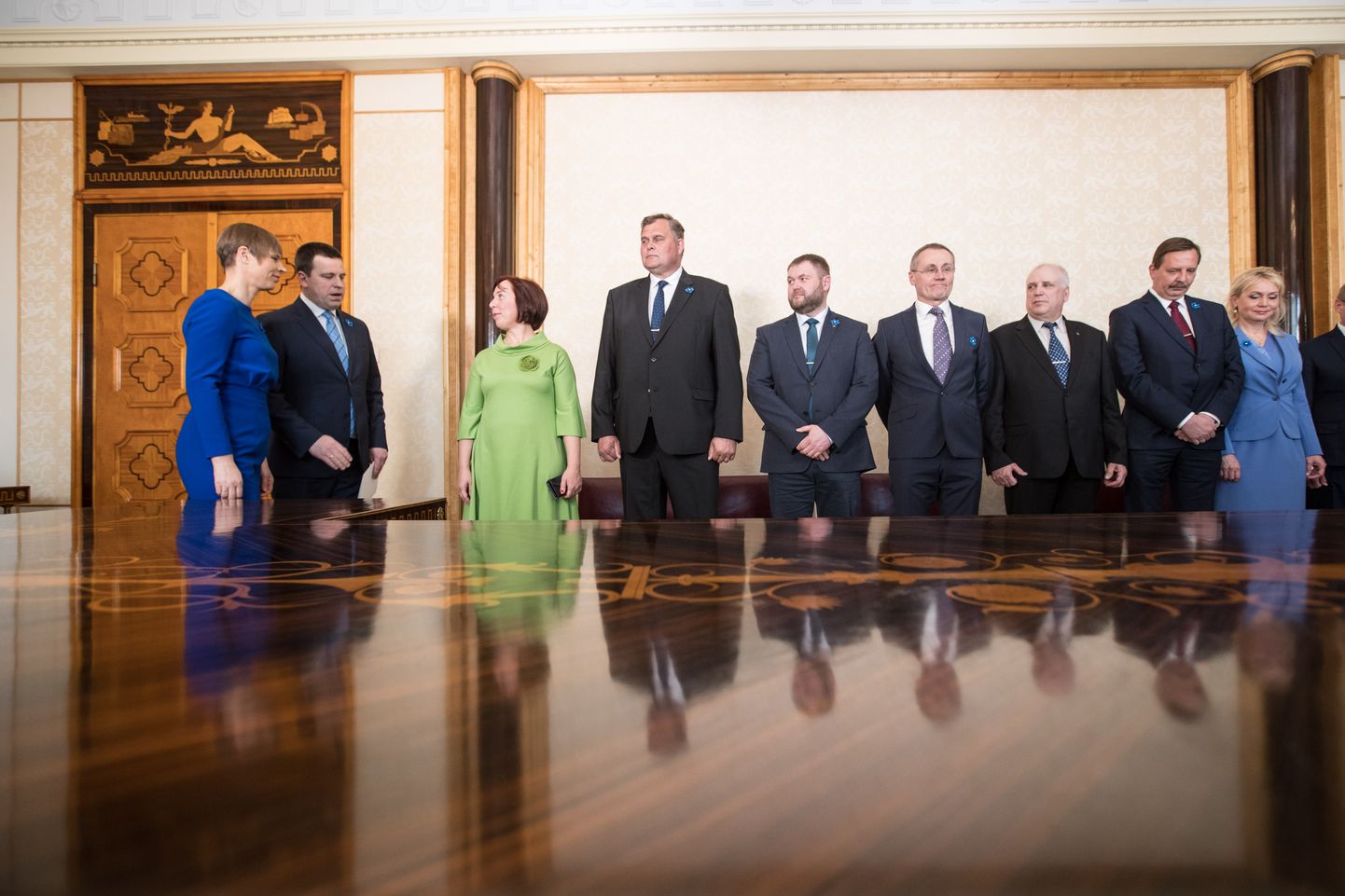 Estonian president appoints 3-party govt into office.