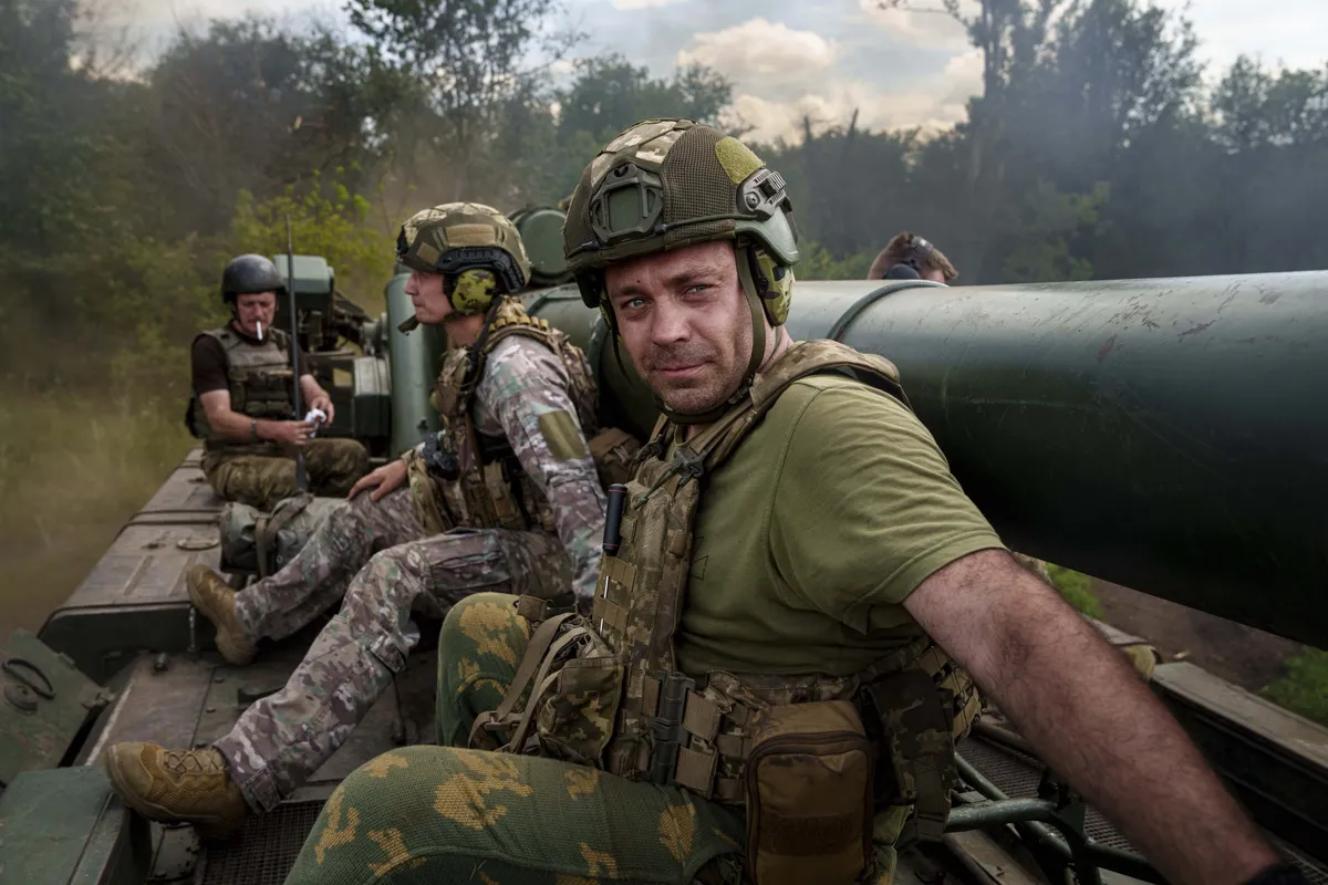 Soldiers from the Ukrainian Army's 43rd Artillery Brigade are moving into position with a self-propelled howitzer in the Donetsk region.