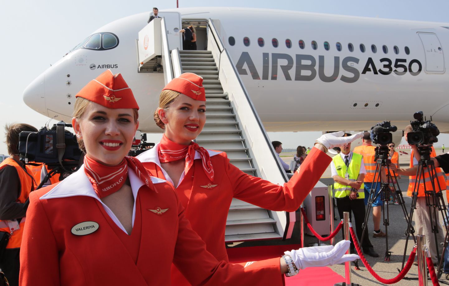 ITAR-TASS: MOSCOW REGION, RUSSIA. AUGUST 12, 2014. Stewardesses stand by a new Airbus A 350-900 aircraft with a wide fuselage at Sheremetyevo International Airport. (Photo ITAR-TASS/ Marina Lystseva)