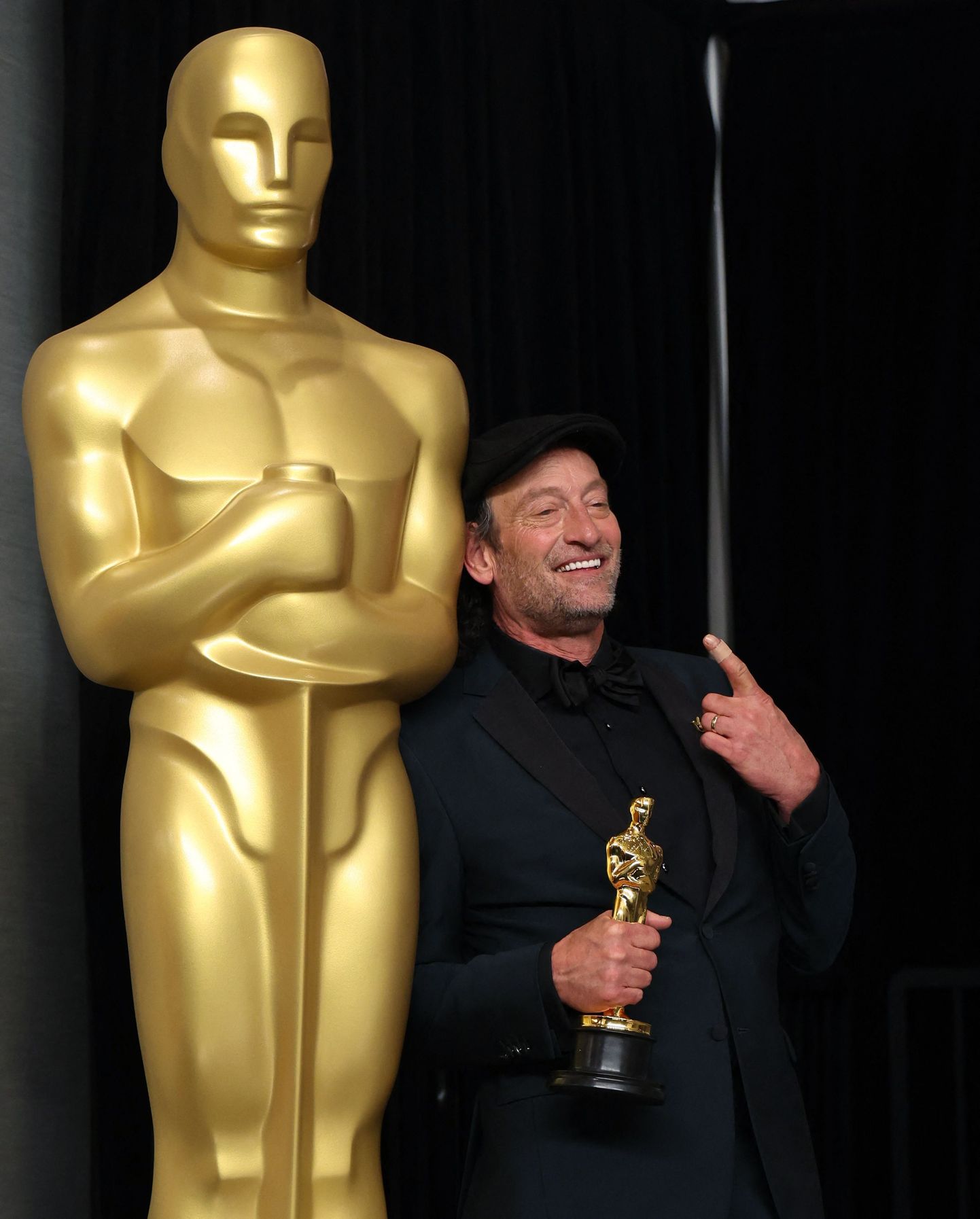 Best Supporting Actor winner Troy Kotsur poses with his Oscar in the photo room during the 94th Academy Awards in Hollywood, Los Angeles, California, U.S., March 27, 2022.  REUTERS/Mario Anzuoni