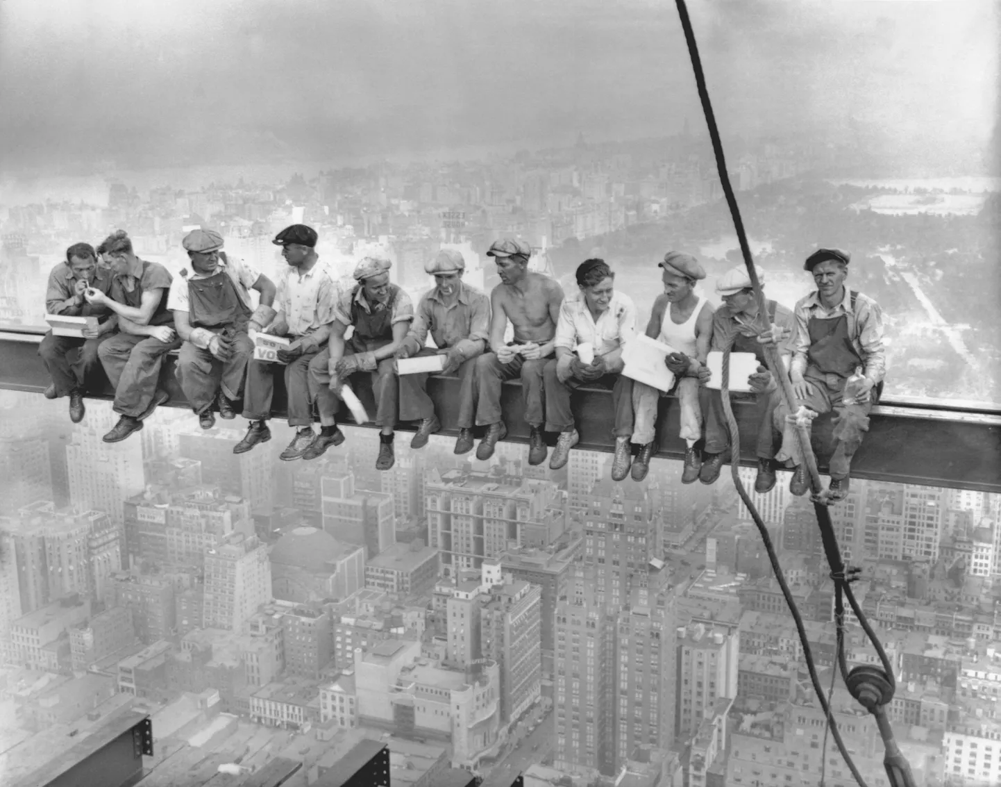 Construction workers eat their lunch atop a steel beam 800 feet above the ground, at the construction site for the RCA Building at the Rockefeller Center, in New York in this handout photo dated September 20, 1932. The historic image "Lunch atop a Skyscraper" was taken 80 years ago. REUTERS/Corbis/Handout (UNITED STATES - Tags: CITYSPACE BUSINESS CONSTRUCTION REAL ESTATE SOCIETY) NO SALES. NO ARCHIVES. FOR EDITORIAL USE ONLY. NOT FOR SALE FOR MARKETING OR ADVERTISING CAMPAIGNS. THIS IMAGE HAS BEEN SUPPLIED BY A THIRD PARTY. IT IS DISTRIBUTED, EXACTLY AS RECEIVED BY REUTERS, AS A SERVICE TO CLIENTS. MANDATORY CREDIT