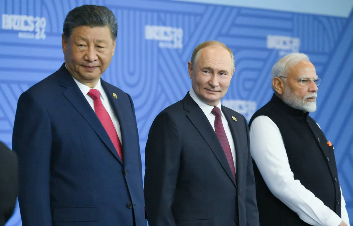 16th BRICS summit. Group photo of heads of delegation: President of Russia Vladimir Putin, President of China Xi Jinping, left, and Prime Minister of India Narendra Modi on the right.