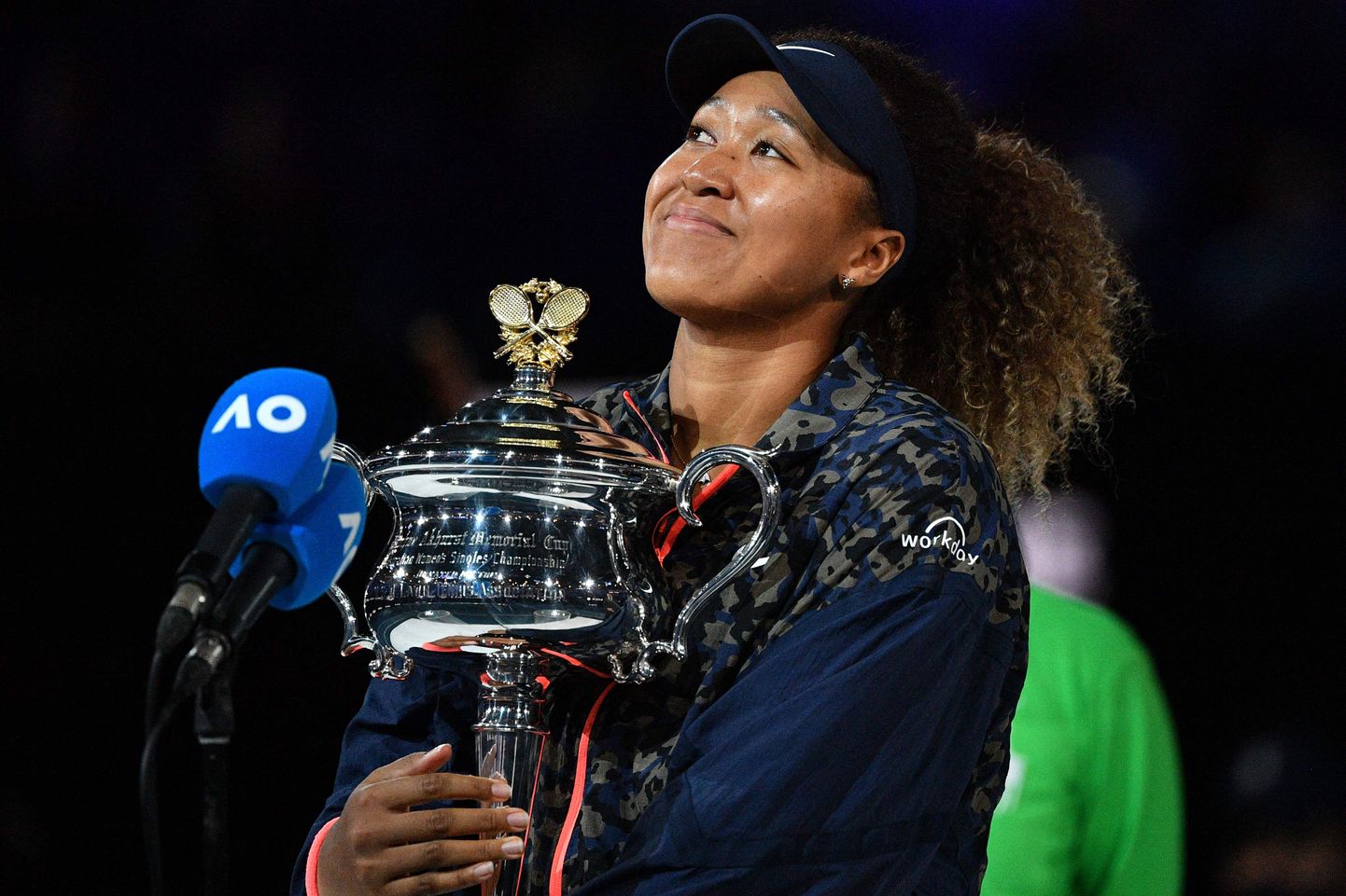 Japan's Naomi Osaka holds the Daphne Akhurst Memorial Cup trophy after beating Jennifer Brady of the US to win her women's singles final match on day thirteen of the Australian Open tennis tournament in Melbourne on February 20, 2021. (Photo by Paul CROCK / AFP) / -- IMAGE RESTRICTED TO EDITORIAL USE - STRICTLY NO COMMERCIAL USE --