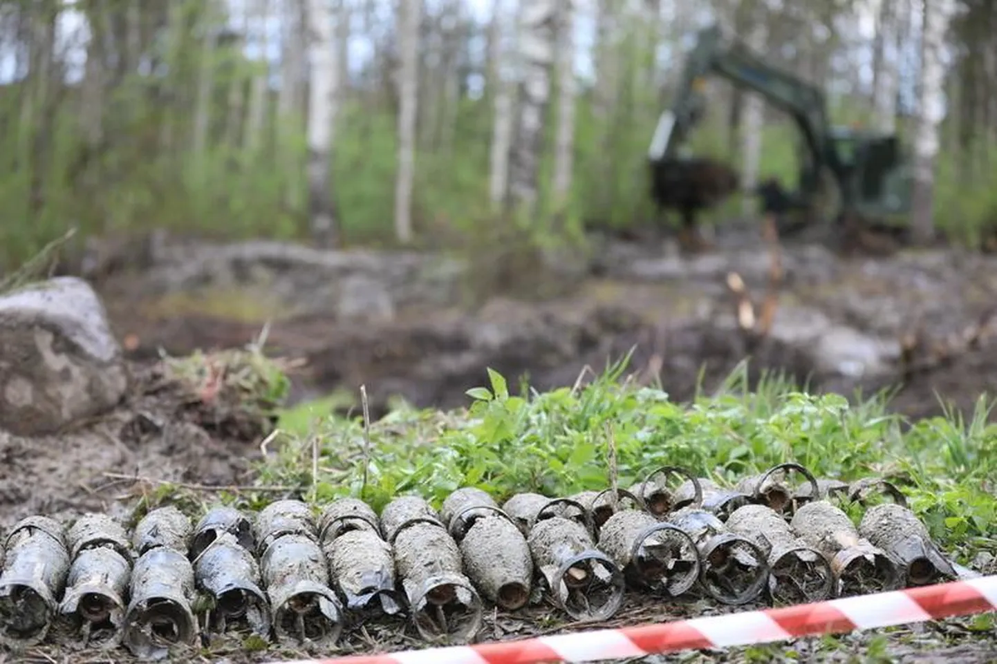 Explosive ordnance specialists of the defense forces clearing World War II-era munitions.