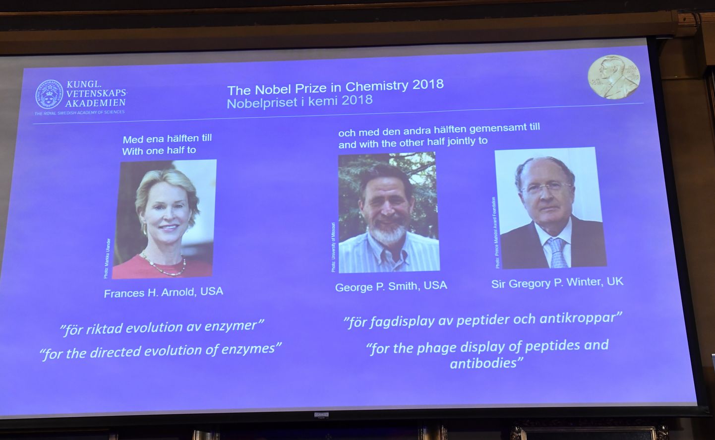 The Nobel Prize laureates for Chemistry 2018 (L-R) Frances H. Arnold, George P. Smith, and Gregory P Winter of Great Britain are displayed on a screen during the announcement at the Royal Swedish Academy of Sciences in Stockholm, Sweden, 03 October 2018.  EPA/Jonas Ekstromer  SWEDEN OUT SWEDEN OUT