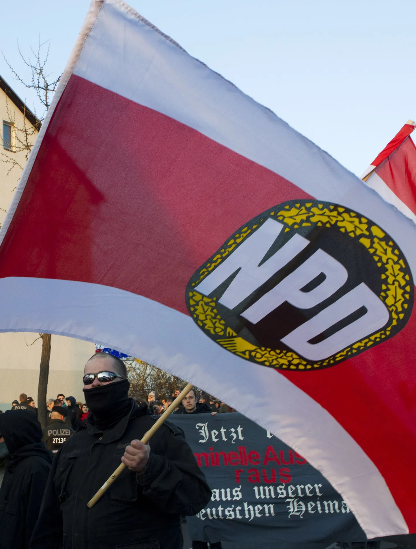 Supporters of the far-right nationalist National Democratic Party of Germany (NPD) march during a rally in Berlin April 13, 2012. Some 50 extreme-right supporters of the NPD marched on Friday through a Berlin suburb, demanding Germany dropped the Euro currency and calling for delinquent foreigners to be expelled.  REUTERS/Thomas Peter (GERMANY - Tags: CIVIL UNREST POLITICS BUSINESS)