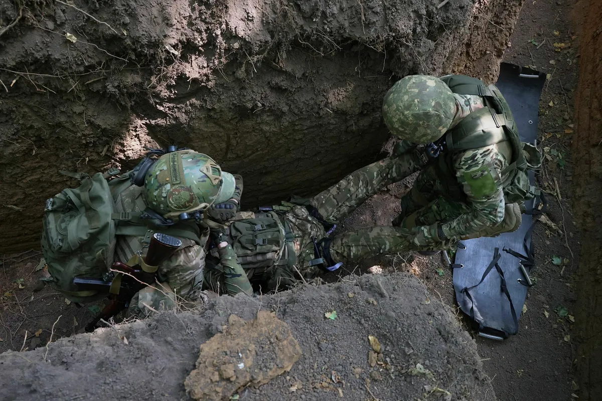 Ukrainian infantry exercising evacuation of a wounded soldier.