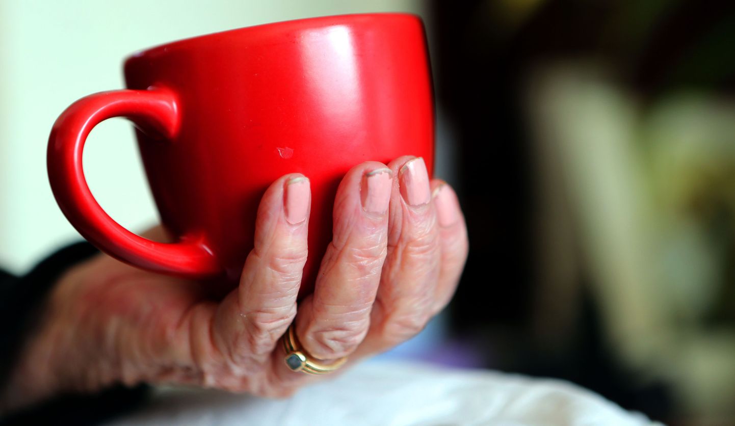 Embargoed to 0001 Wednesday January 11 File photo dated 07/10/13 of an elderly woman holding a cup of tea. People in middle to old age should stop drinking tea or coffee after lunch in order to get a good night's sleep, experts have said.