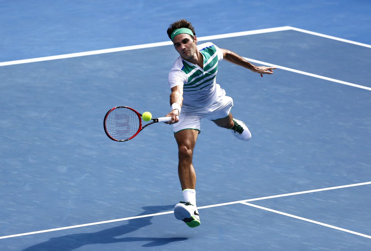 Roger Federer of Switzerland plays a forehand return to Tomas Berdych of the Czech Republic during their quarterfinal match at the Australian Open tennis championships in Melbourne, Australia, Tuesday, Jan. 26, 2016.(AP Photo/Rafiq Maqbool)