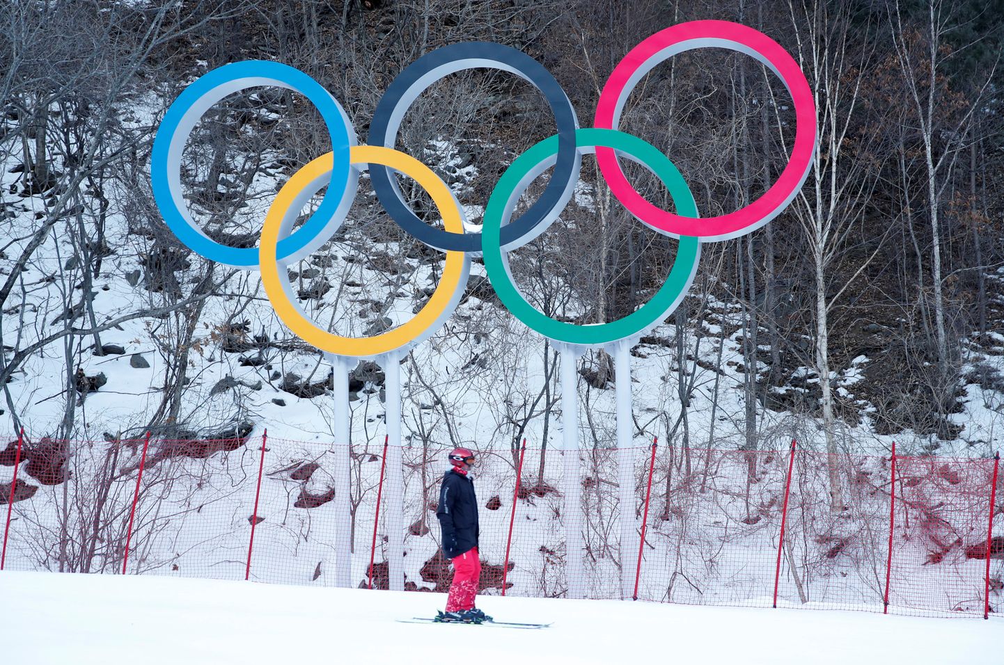 FILE PHOTO: Alpine Skiing – Pyeongchang 2018 Winter Olympics – Men’s Downhill – Jeongseon Alpine Centre - Pyeongchang, South Korea – February 11, 2018 - The Olympics rings are seen at the Alpine venue after the men's downhill was postponed due to strong winds. REUTERS/Mike Segar/File Photo