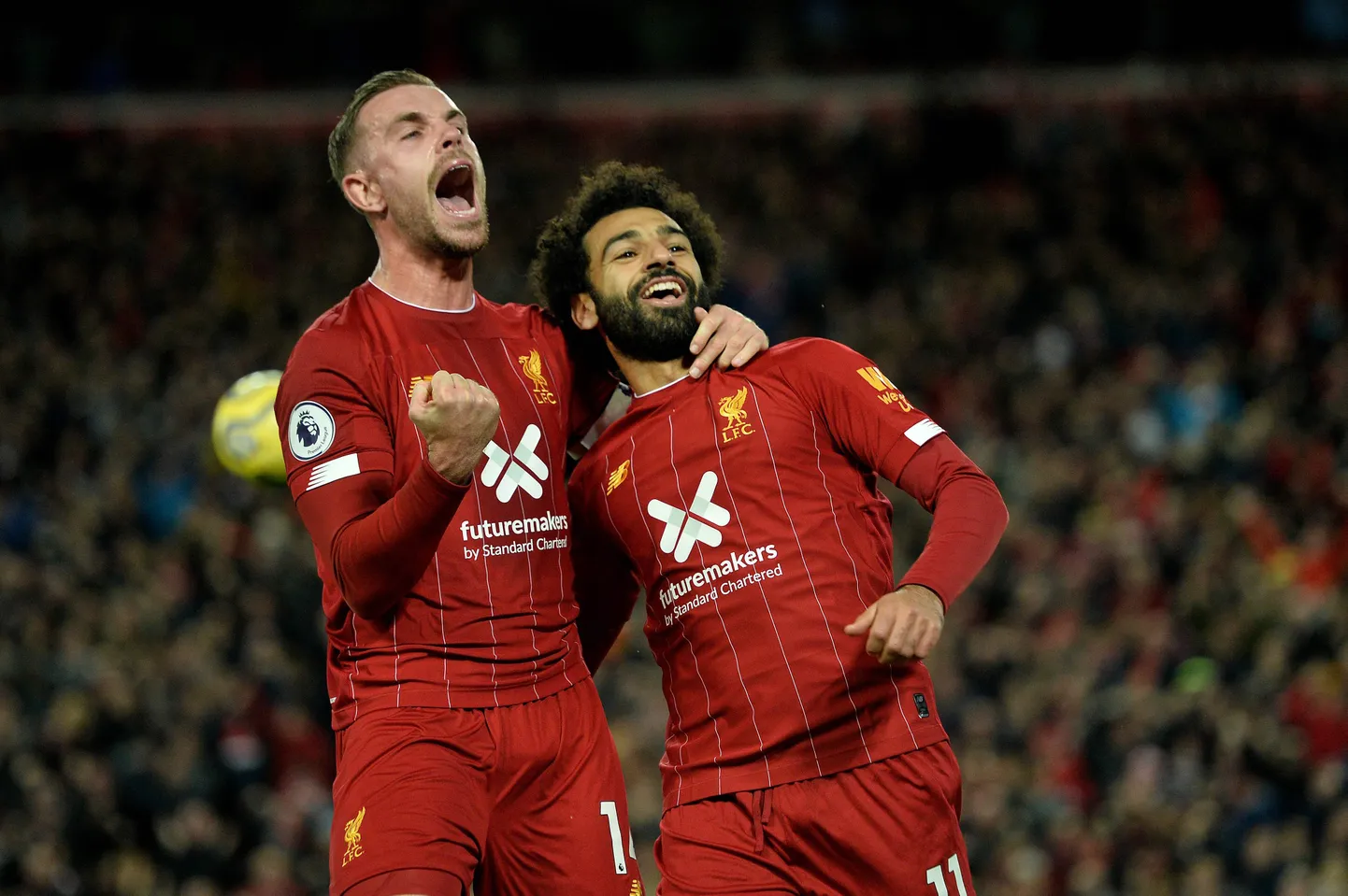 Liverpooli mängijad Jordan Henderson ja Mohamed Salah.