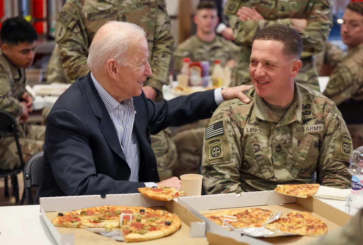 U.S. President Joe Biden speaks with a paratrooper from the 82nd Airborne Division in Poland.