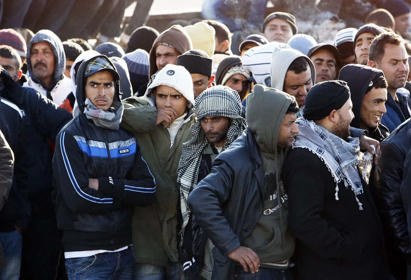 Беженцы из Туниса на Лампедузе.