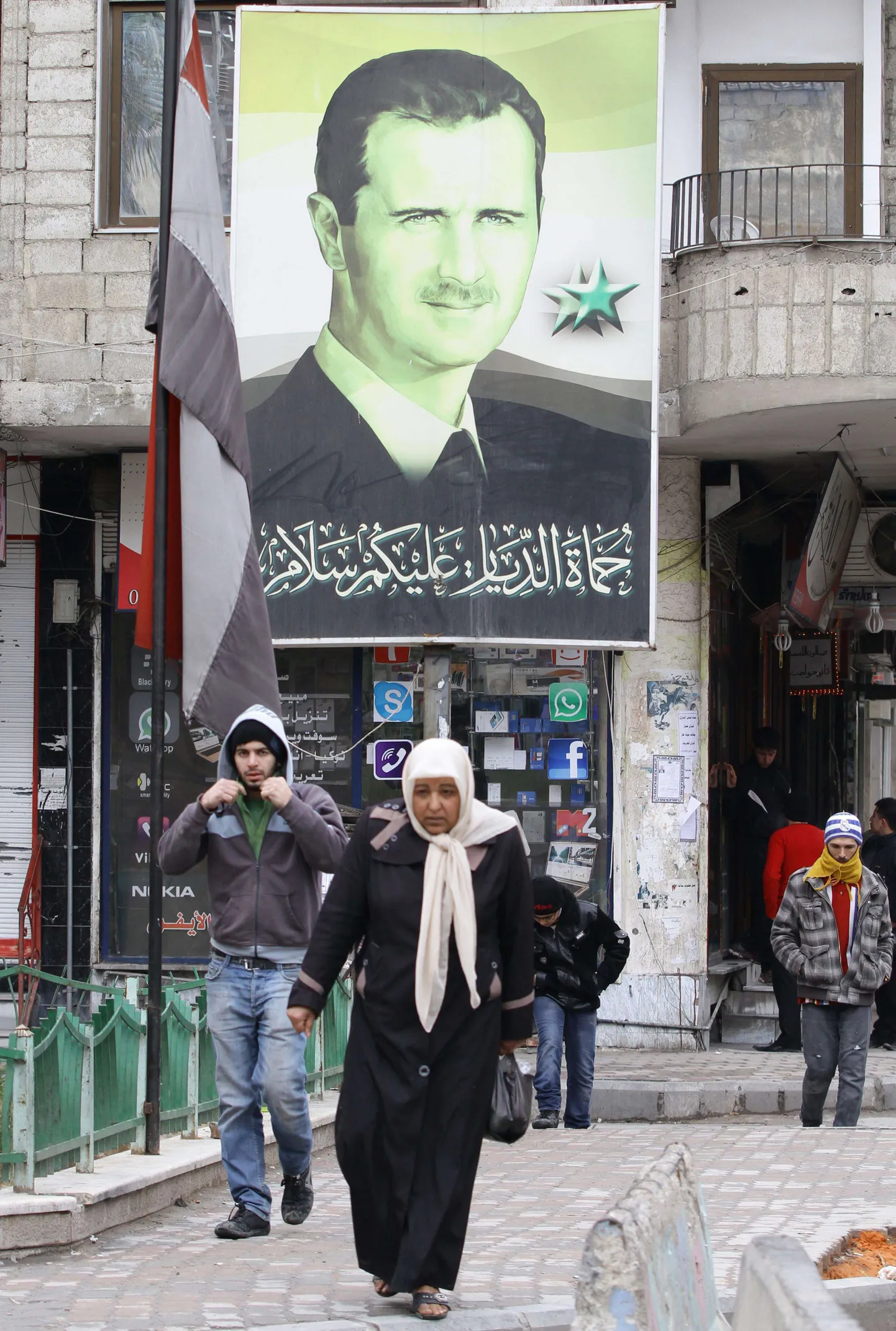 Süüria president Bashar al-Assadi pildiga plakat pealinnas Damaskuses.