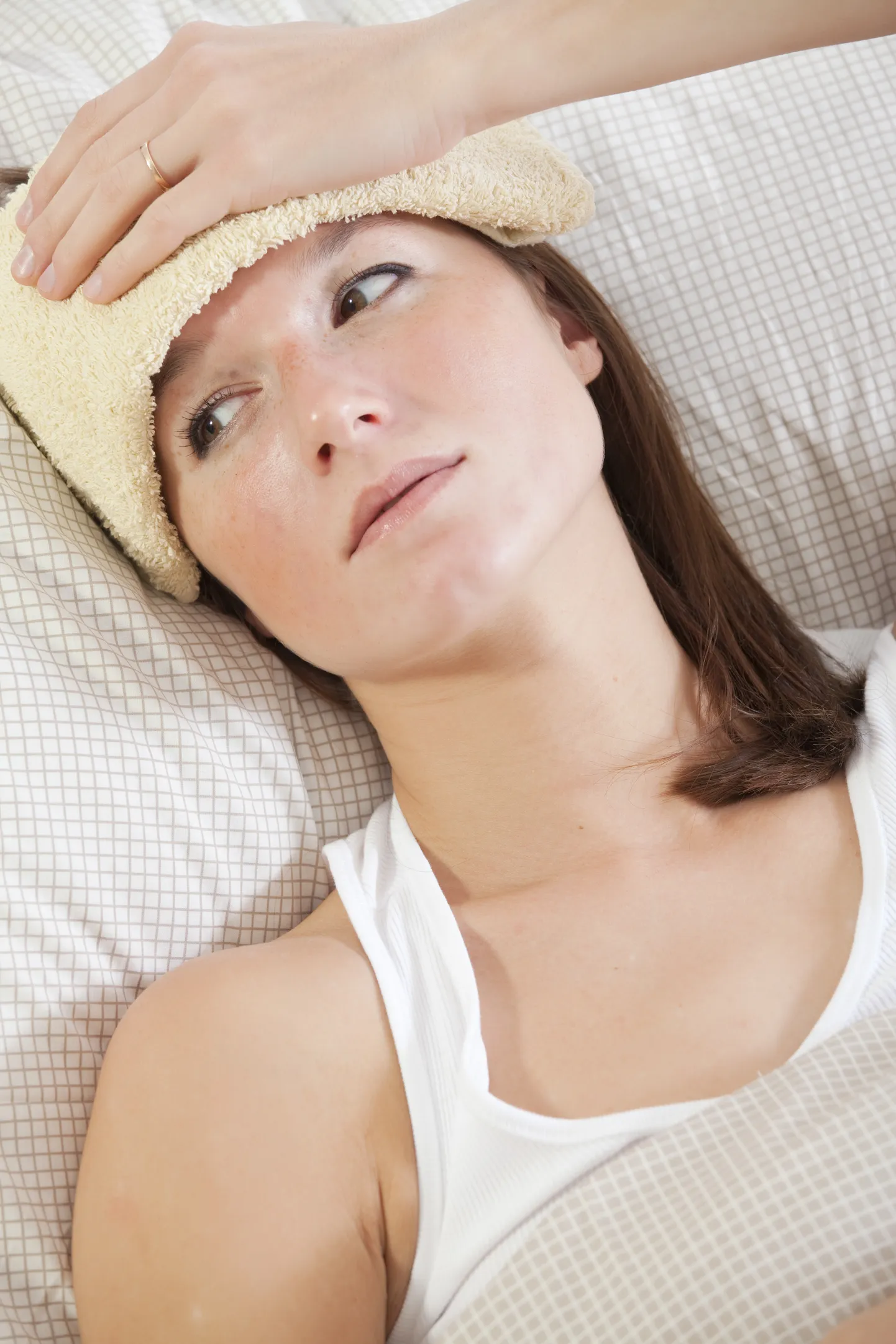 woman with high fever in bed