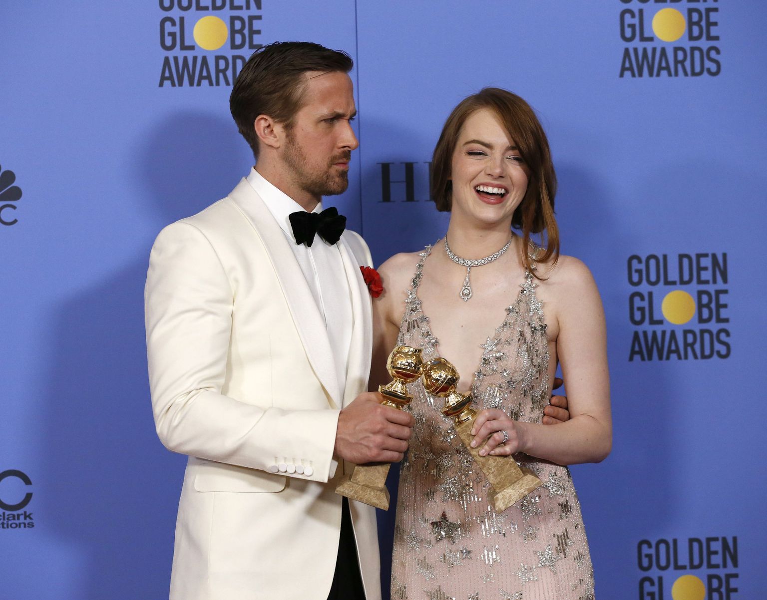 Ryan Gosling and Emma Stone pose with their awards for Best Performance by an Actor in a Motion Picture - Musical or Comedy and Best Performance by an Actress in a Motion Picture - Musical or Comedy for their roles in "La La Land" during the 74th Annual Golden Globe Awards in Beverly Hills, California, U.S., January 8, 2017.  REUTERS/Mario Anzuoni