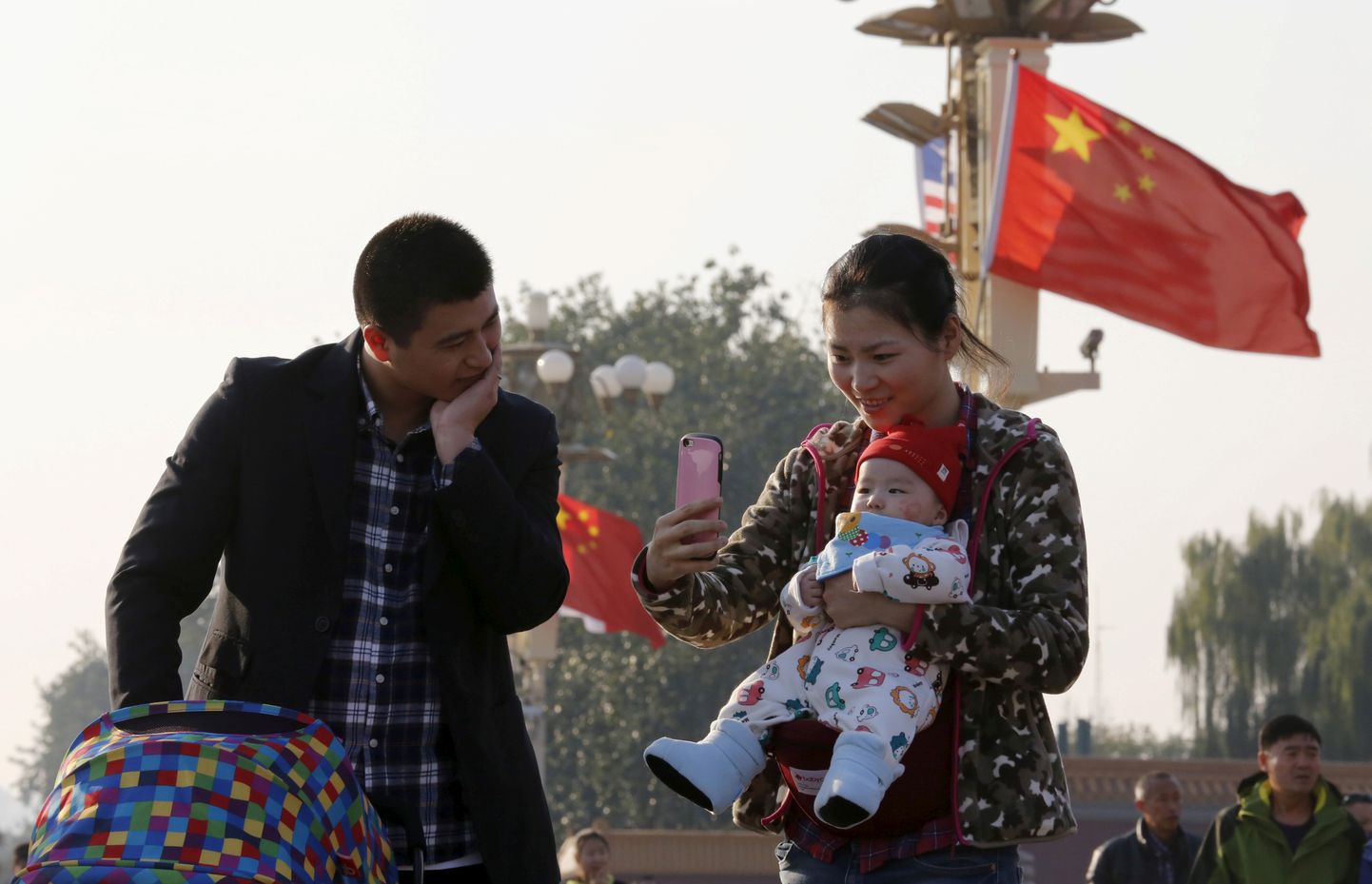 Hiina perekond Tiananmeni väljakul Pekingis.