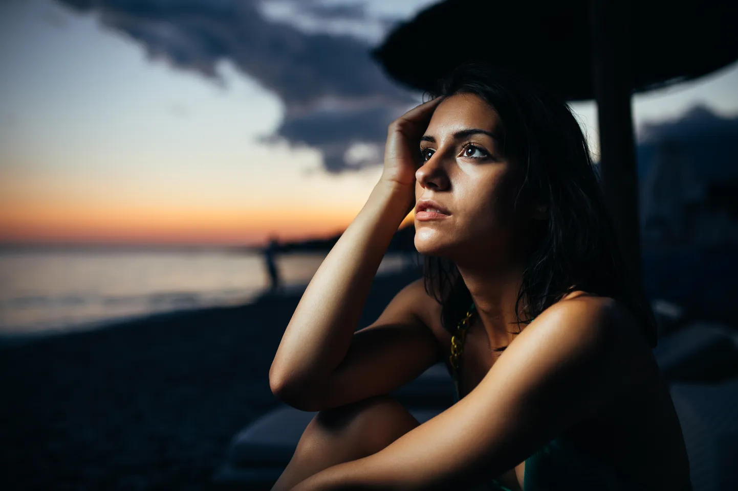 Stargazing woman at the beach at sunset. Relaxing mindful evening in nature, looking at the meteor shower. Impressive star night sky.Beautiful milky way view.Constellation curiosity and horoscope