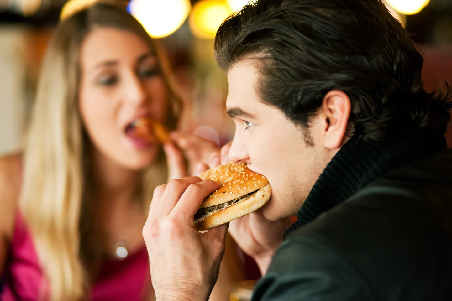 couple in restaurant eating fast food
