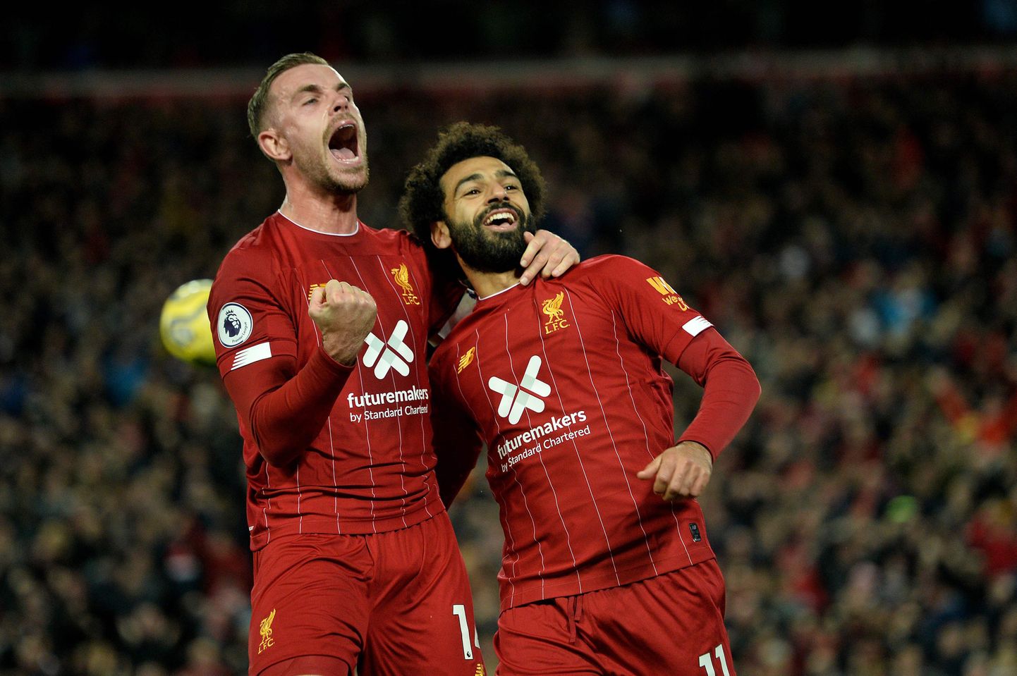 Liverpooli mängijad Jordan Henderson ja Mohamed Salah.