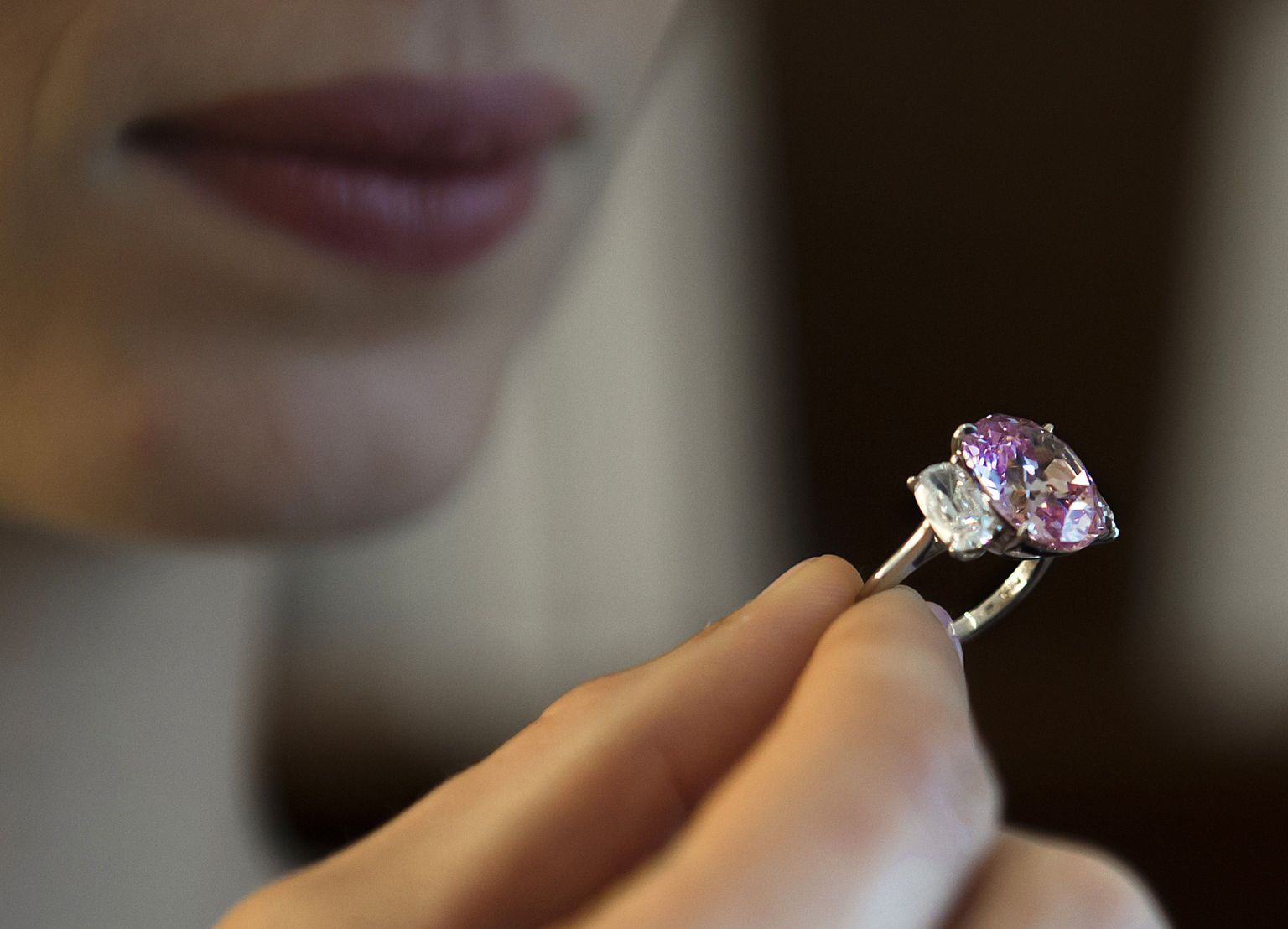 A picture taken on April 30, 2015 shows a 8.72 carats Fancy Vivid Pink diamond during a preview at auction house Sothebys in Geneva. The Historic Pink Diamond, believed to have once belonged to Napoleon's niece, and the deep red Sunrise Ruby figure among a wide range of pieces for sale at Sotheby's spring Magnificent Jewels and Nobel Jewels auction in Geneva on May 12.  AFP PHOTO / Richard Juilliart